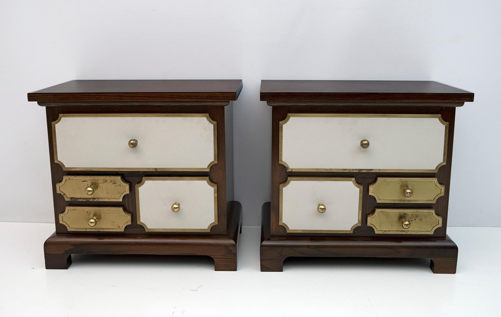 Set designed by Luciano Frigerio in the 60s, consisting of two bedside tables and chest of drawers. Solid walnut set, drawers with brass frames and ivory velvet upholstery, the whole set has been completely restored and polished with shellac. The