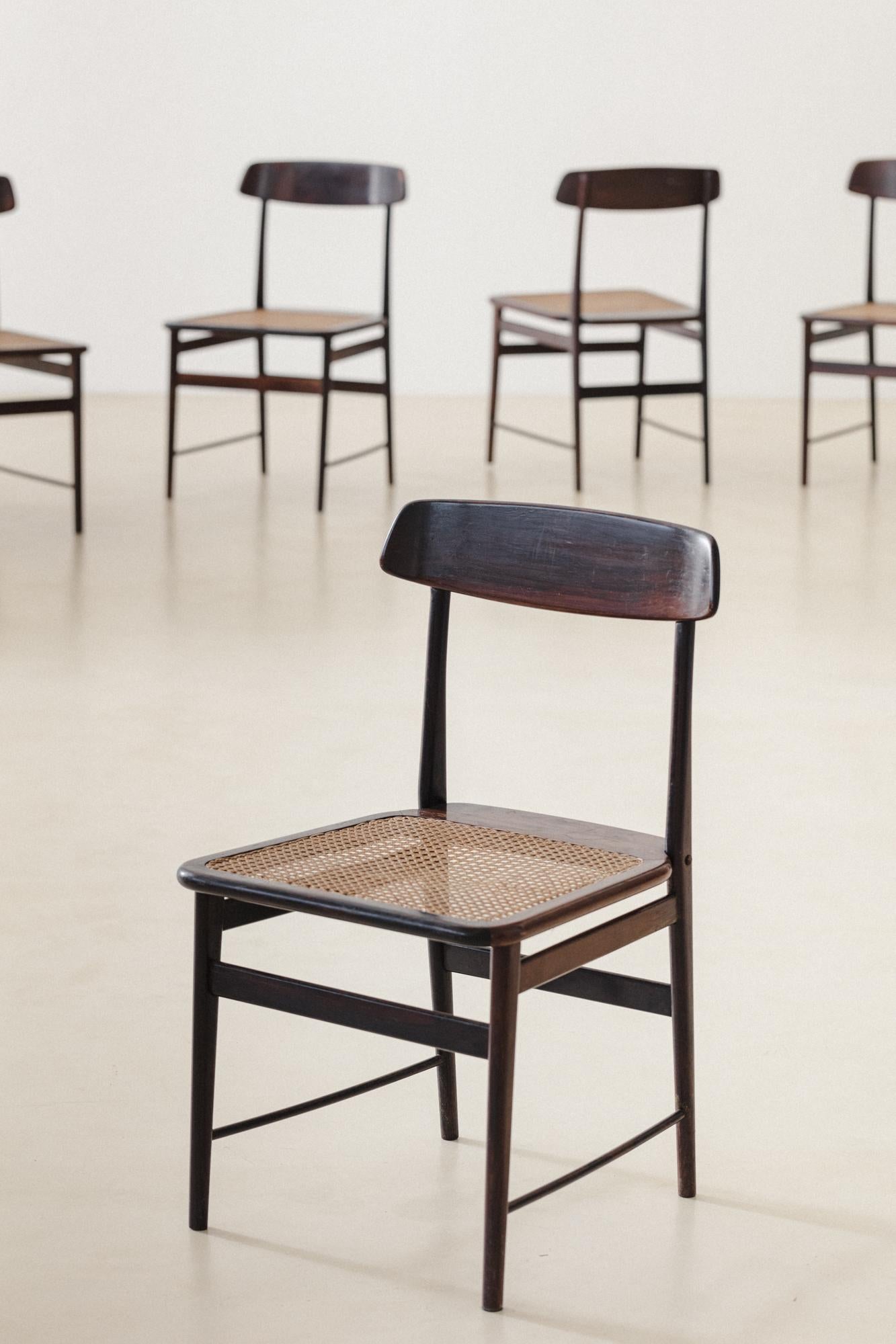 The Lucio chair is an icon of Brazilian design, made with a solid wood structure, originally rosewood, and a flat cane seat. The backrest is sculpted with anatomical design and turned feet. Sergio Rodrigues designed this piece in 1956 in honor of