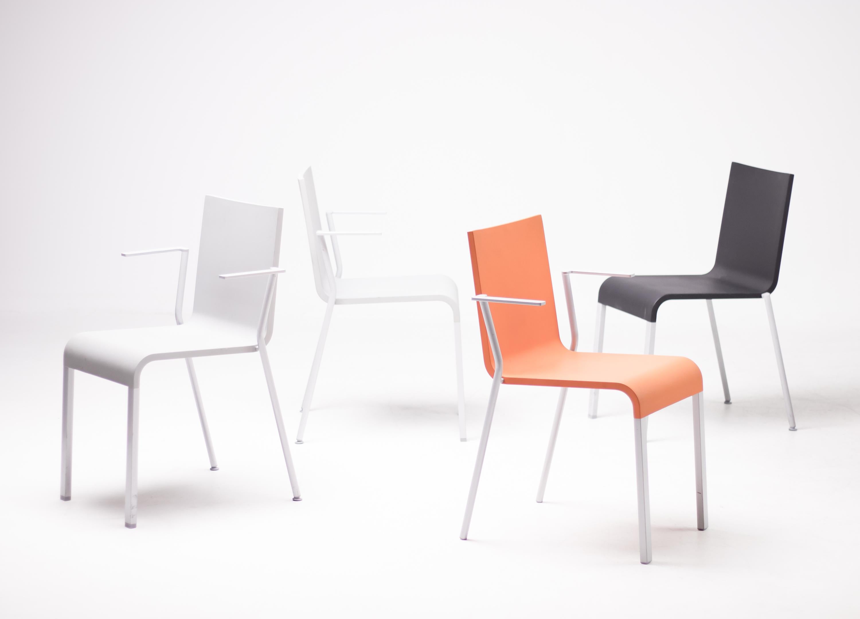 Set of 4 stackable chairs by Belgian designer Maarten van Severen for Vitra.
Model .03 chair, 3 rare examples with arms, 2 light grey and 1 orange, and 1 dark grey without arms.
 