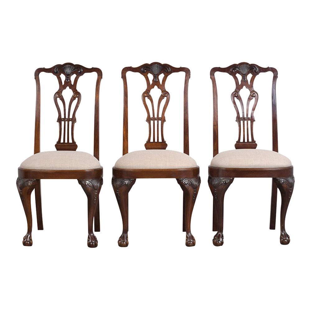 This Set of Six Late 19th Century Regency Style Dining Chairs are made out of mahogany wood with a rich mahogany color stain and a new semi-gloss finish. These antique chairs feature hand-carved details of scrolls & leaves, seats have been