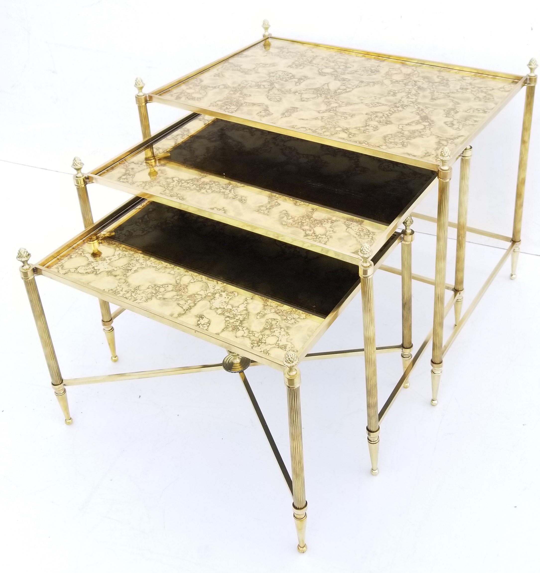 Set of Maison Baguès bronze nesting table, 3 tables 
Gold cloudy mirrors.
Dimensions : W/D/H
23/16/19
20/15/16
19/14/14.
  