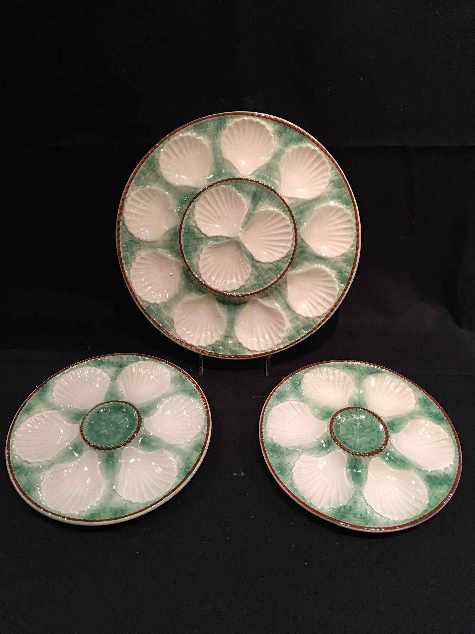 Set of Majolica long champ nine oyster plates and a platter, 19th century. Plates are 9.5