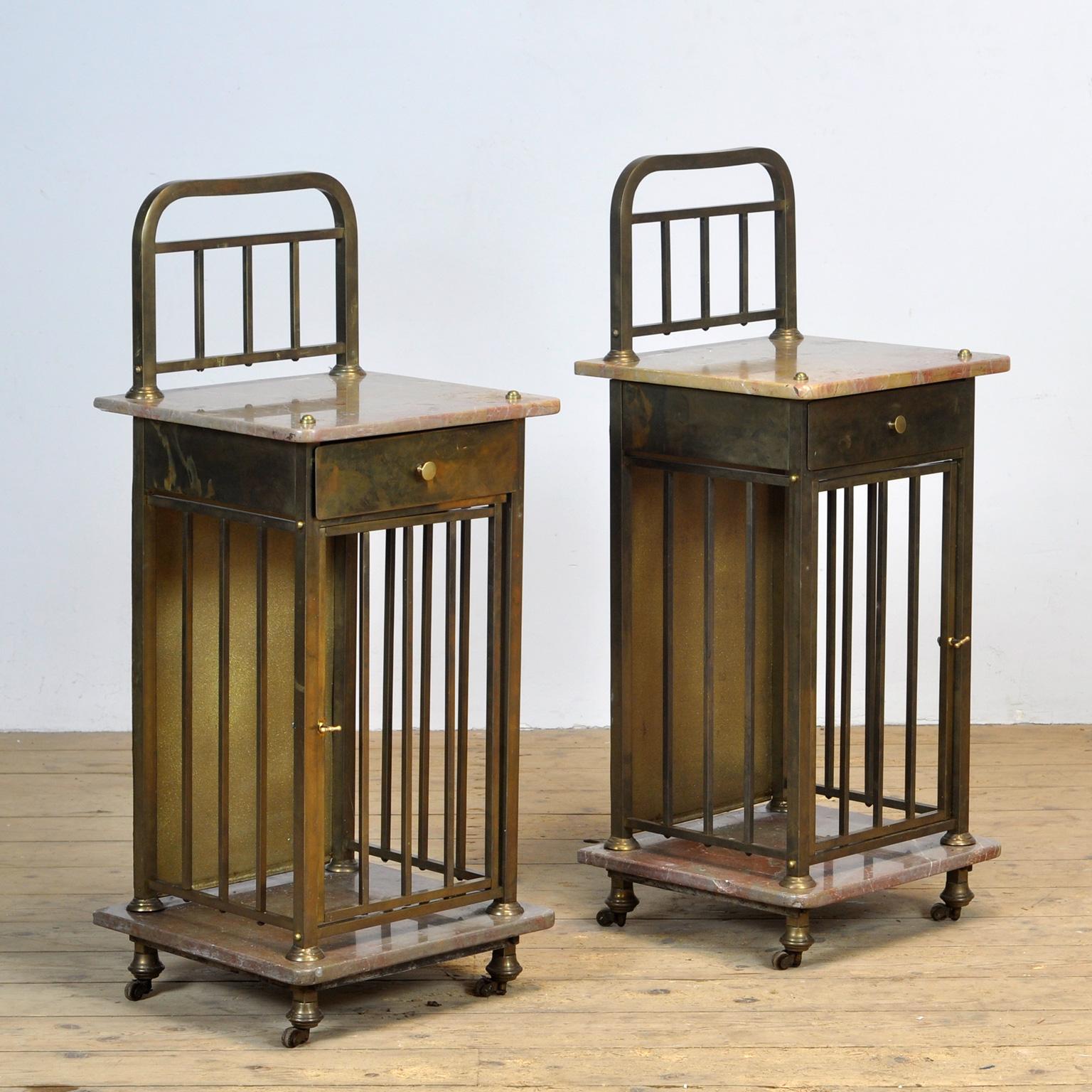 Set of bedside tables produced around 1880. The cabinets have a drawer with space underneath for books, etc. The set is made of brass with marble tops.
Height of top top: 80 cm