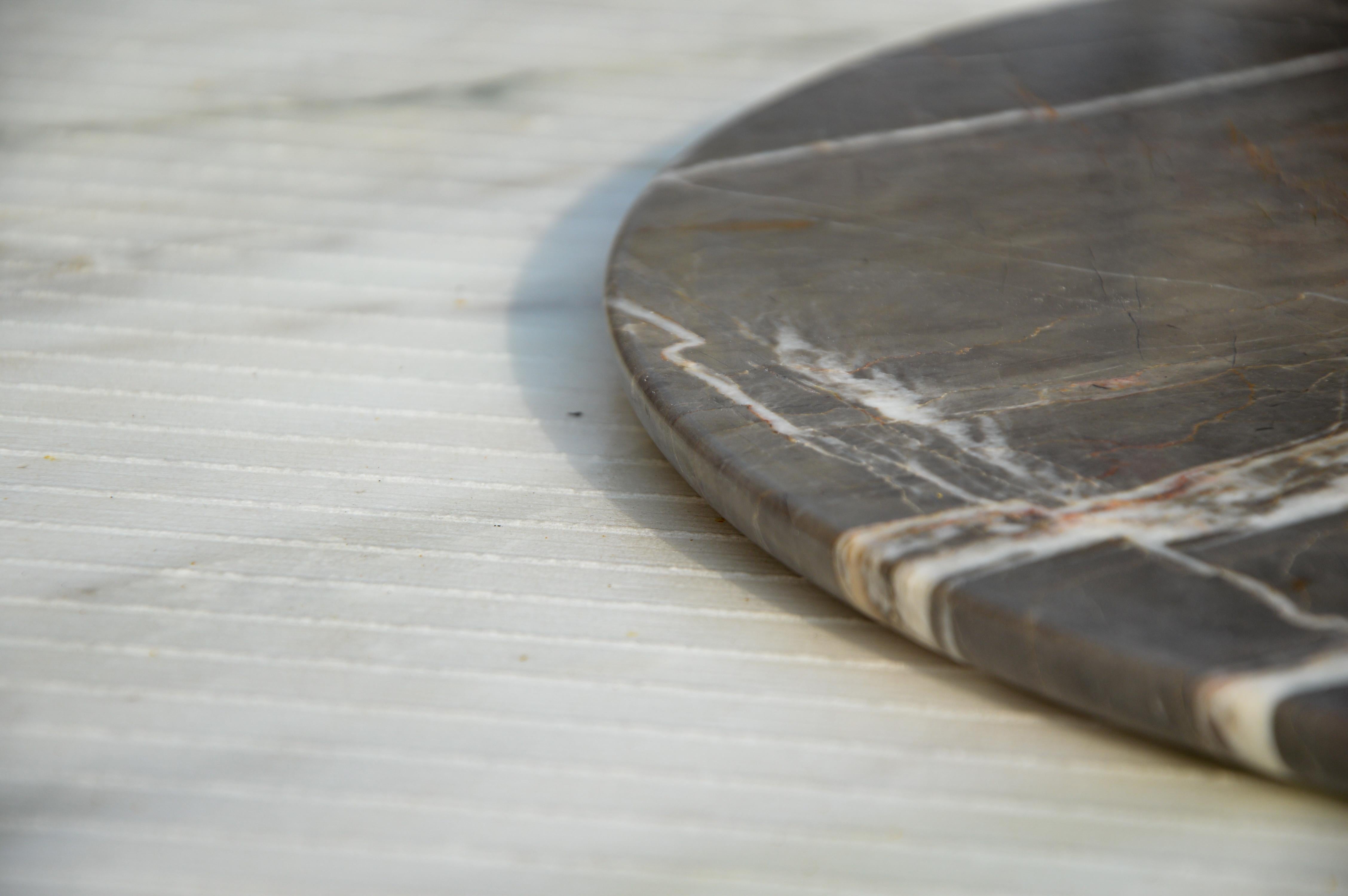 The Emotion Collection of marble plates brings timeless elegance and artisanal craftsmanship to the dining experience. Offered as a set of six plates, each piece is carved from exquisite natural marble, with the freedom to fully customize according