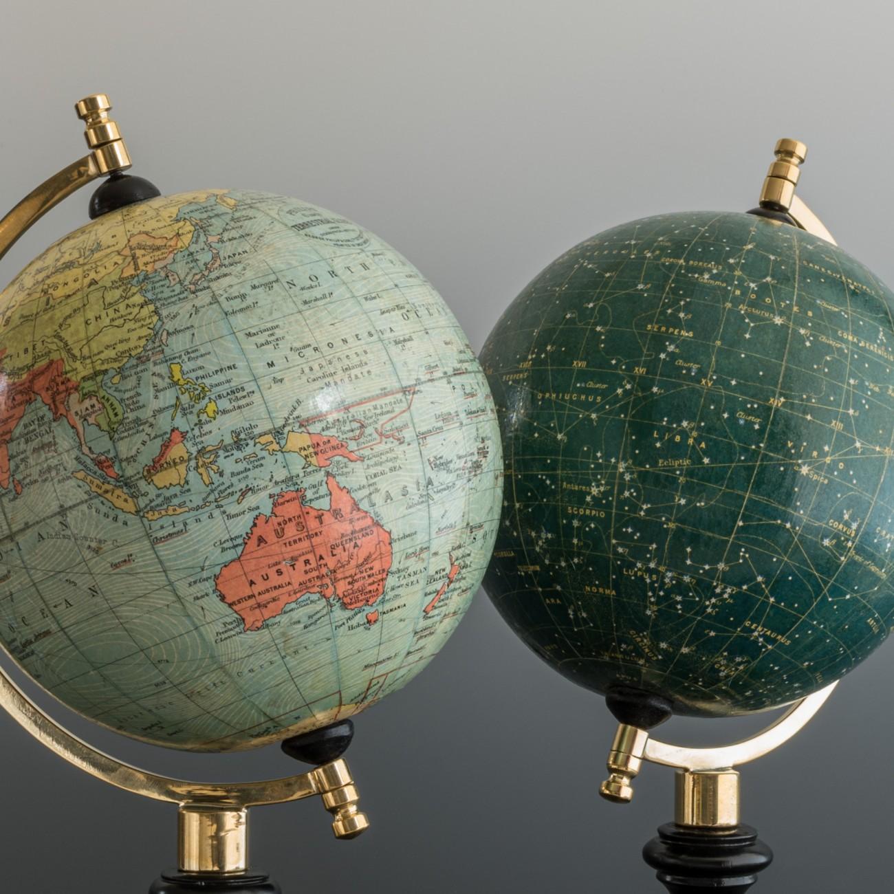 A wonderful set of matching Terrestrial and Celestial 6 inch globes by George Philip and Son with brass semi-meridian mounts on ebonised turned wood bases, circa 1935.

The celestial globe shows the constellations and many named stars.
When looking