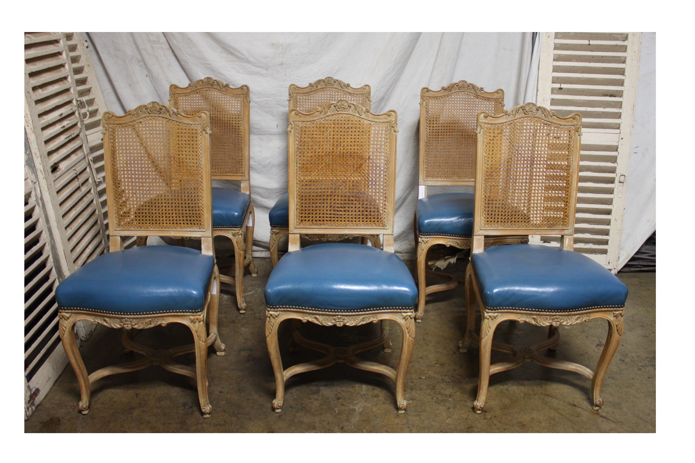 Set of mid-20th century French dining chairs.