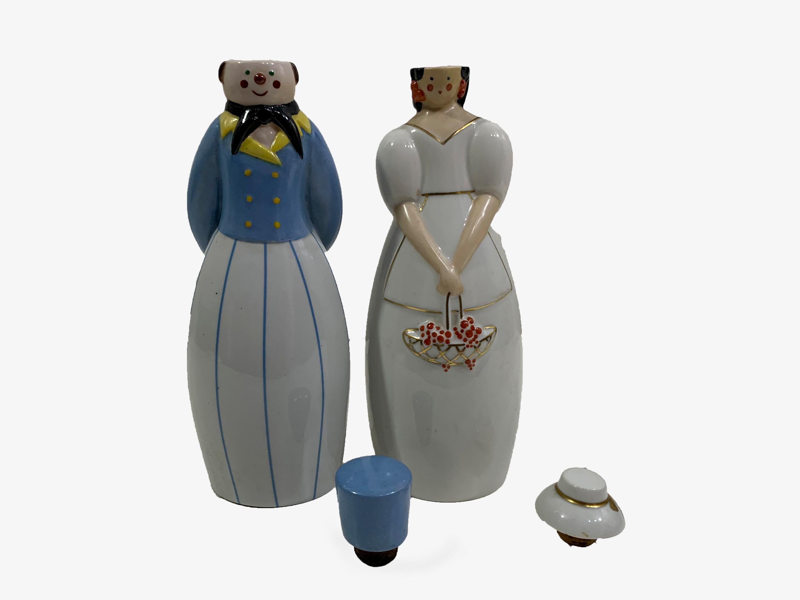 A set of  Art Deco 1930s 'Coda Collection' anthropomorphic flask, or liquor bottle modelled as a Russian figure and a Lady. This 