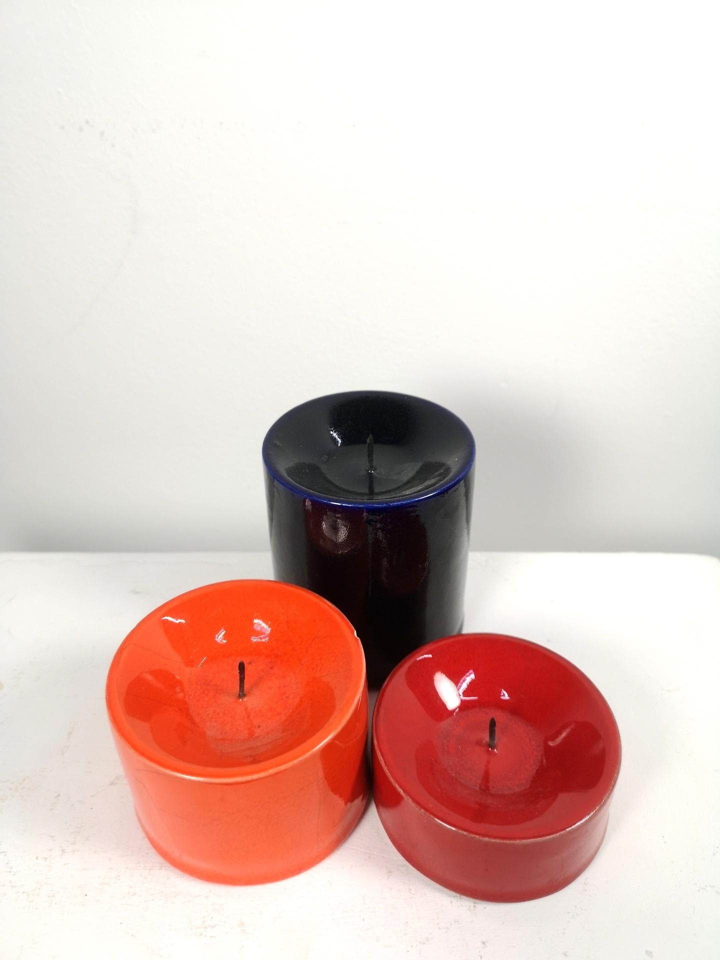 Set of Mid-Century Modern ceramic candleholders, from the 1970's artisan period. They're signed, and generally in good condition, although some minor chips, scratches may occur due to vintage age.