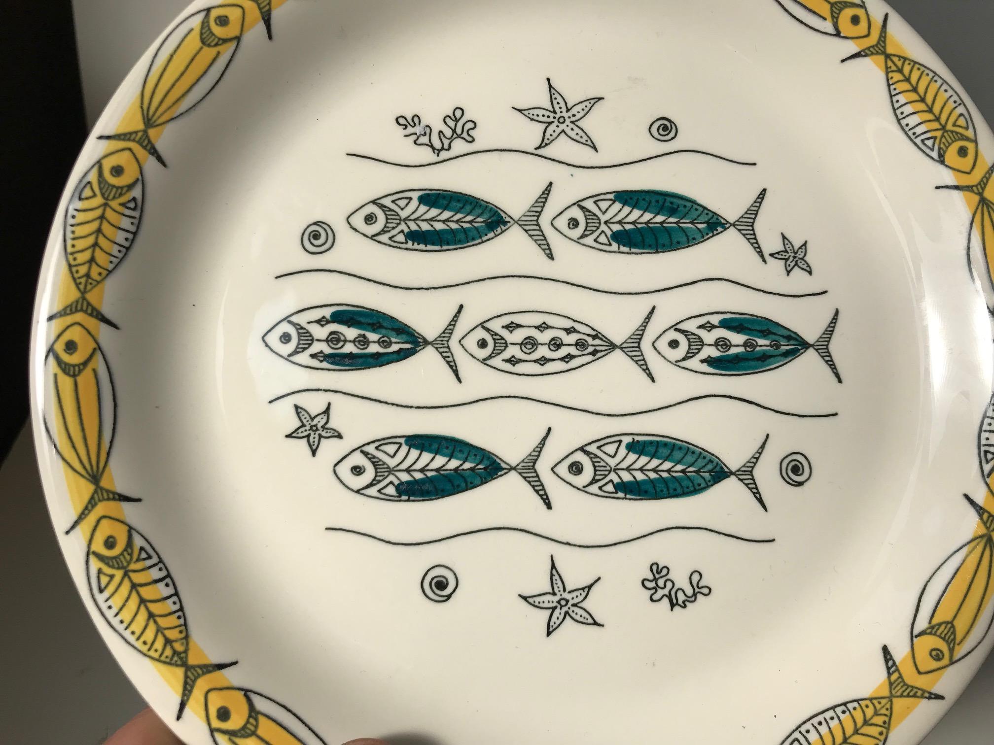 A rare set of 6 ceramic fish plates designed by Norwegian ceramist Inger Waage and manufactured by Stavangerflint during the 1950s. The plates features modernistic fish motifs and characteristic 1950s colors and graphics. The price is for the set.