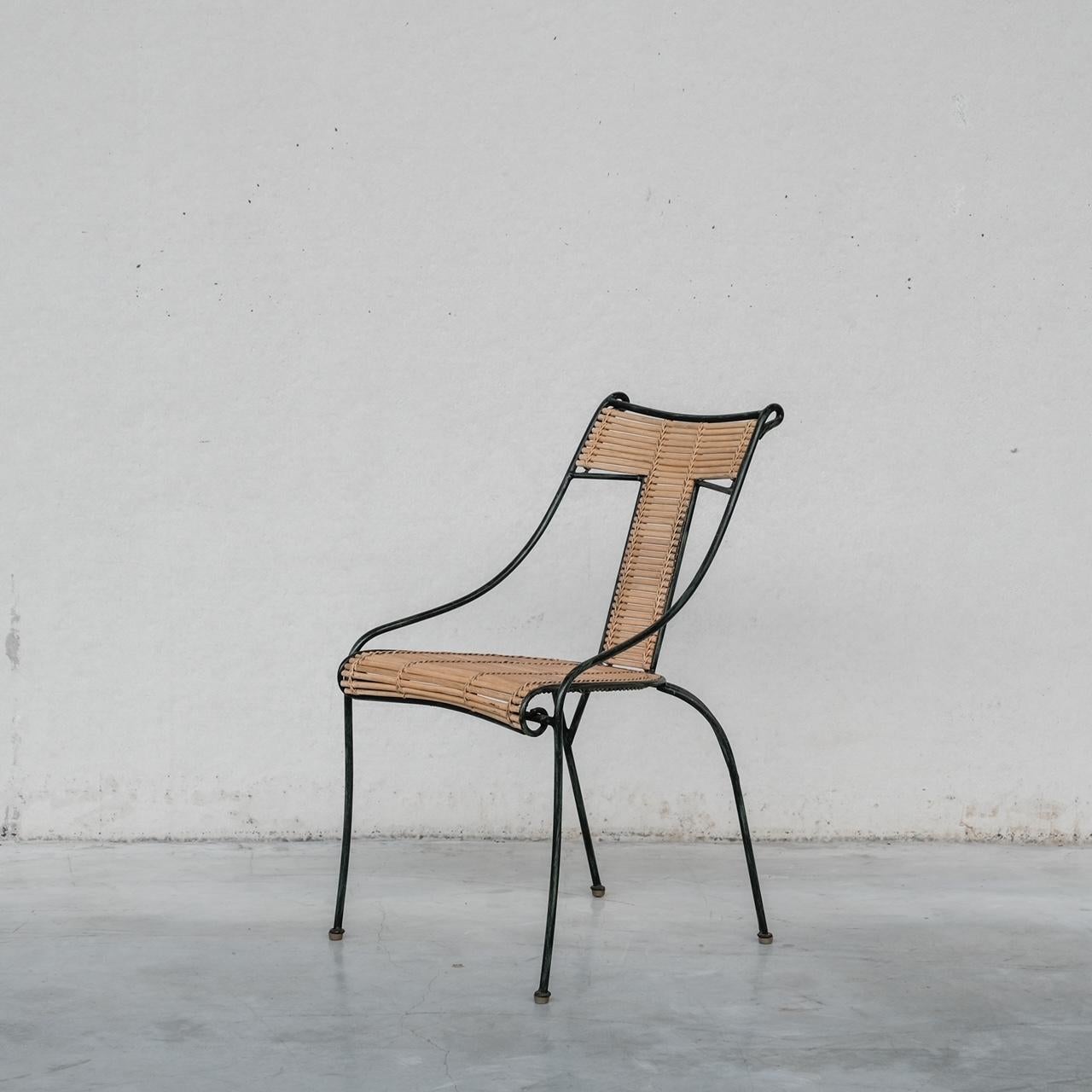 Ensemble de huit chaises de salle à manger. 

Fer peint et bambou. 

Danemark, années 1970. 

Vraisemblablement fabriqué par Lysberg Hansen & Therp

Bon état général. Une ou deux chaises sont un peu effilochées, mais elles sont encore très