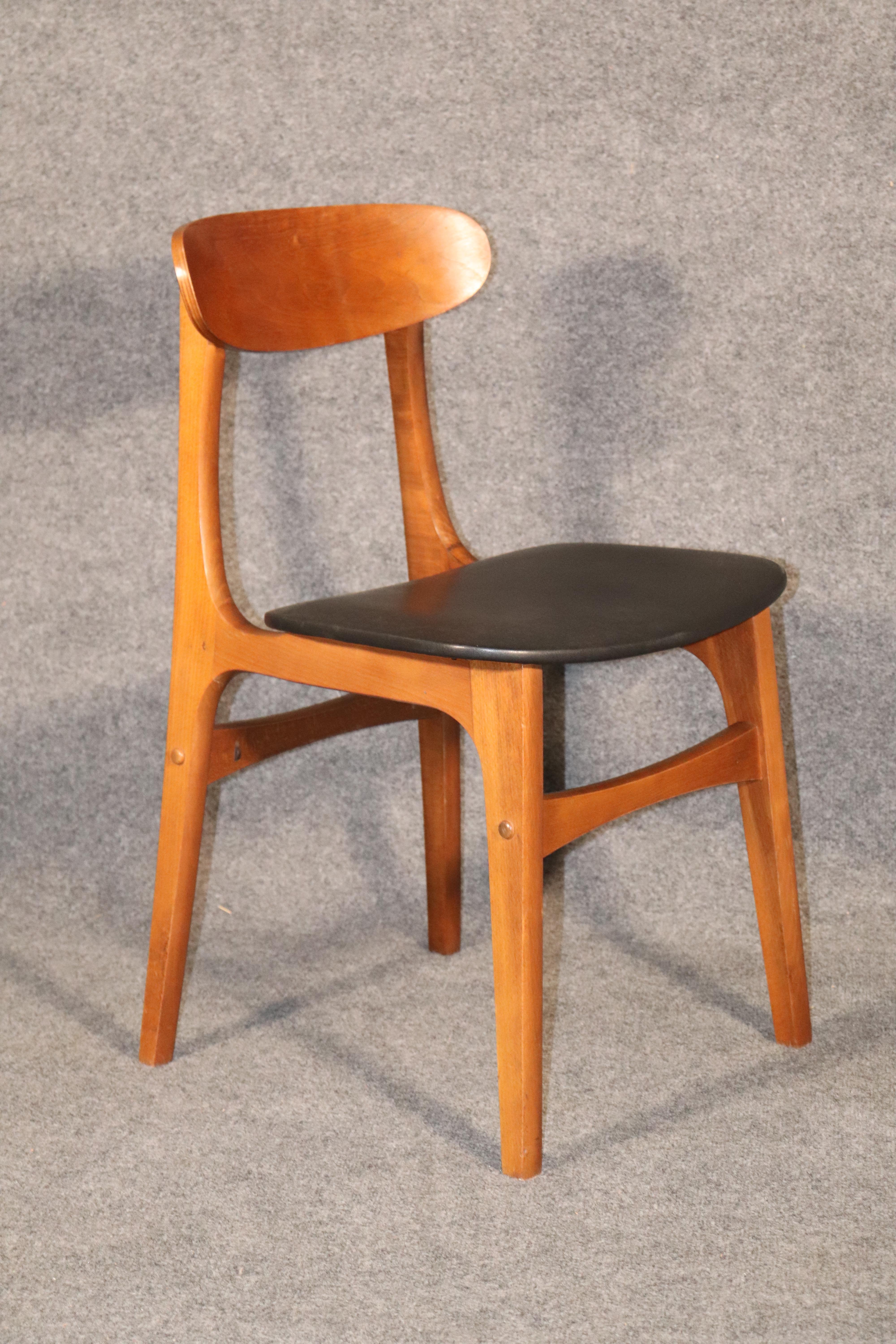 Set of four Mid-Century Modern dining chairs in walnut wood frame. Vinyl seat coverings and sculpted wood backs.
Please confirm location.