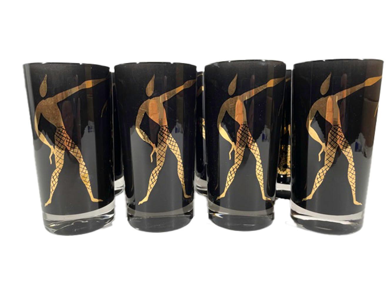 Vintage set of 8 highball glasses. Clear glass with black frosted interiors decorated on the exterior with stylized modern dancers in 22k gold.