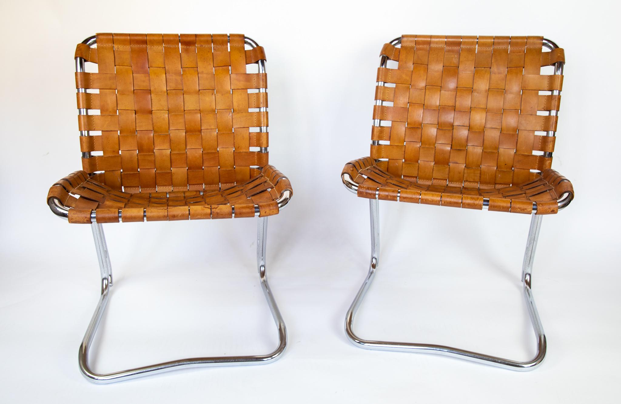 Mid Century Lounge Chairs Chrome Plated Patinated Cognac Leather, Italy, 1970s.

This very rare pair of cognac lounge chairs are made of chrome plated solid metal frames with amazing patinated cognac saddle leather straps and because of their age