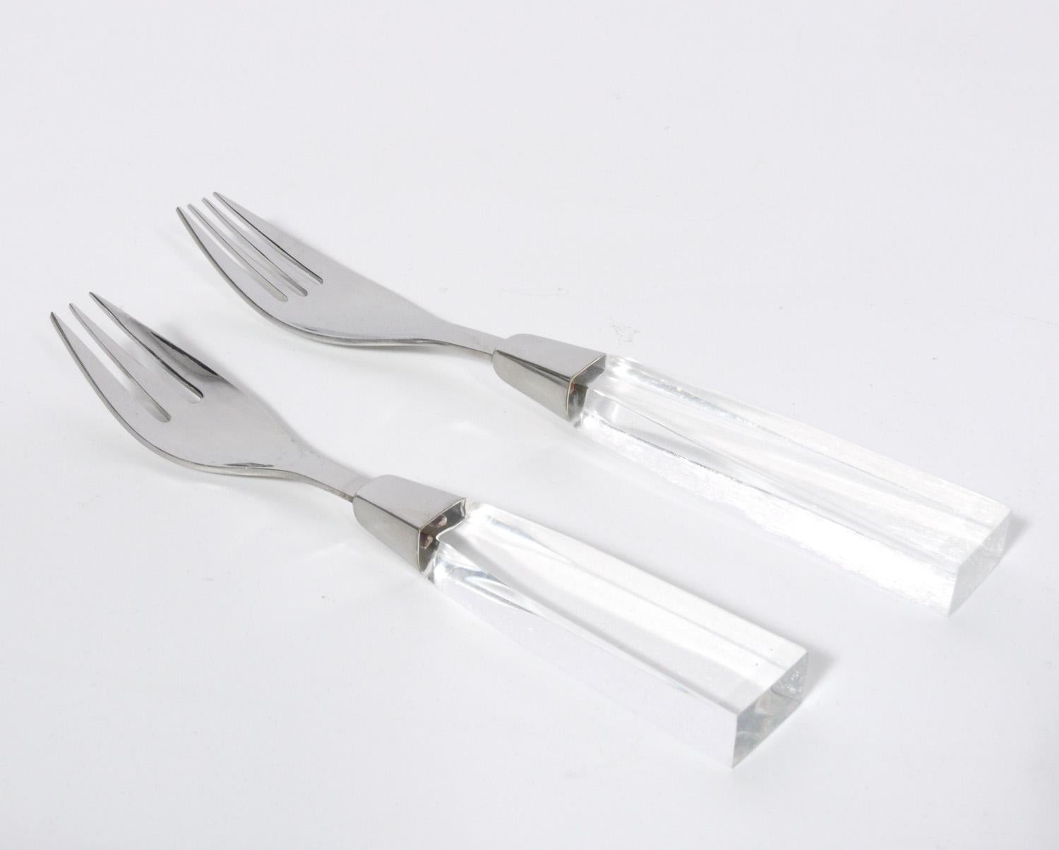 Set of midcentury Lucite flatware made by Supreme Cutlery, Japan, circa 1960s. It is a complete set of pieces. They are constructed of 18-8 stainless steel and Lucite or acrylic, making them dishwasher safe and a good choice for daily usage. The