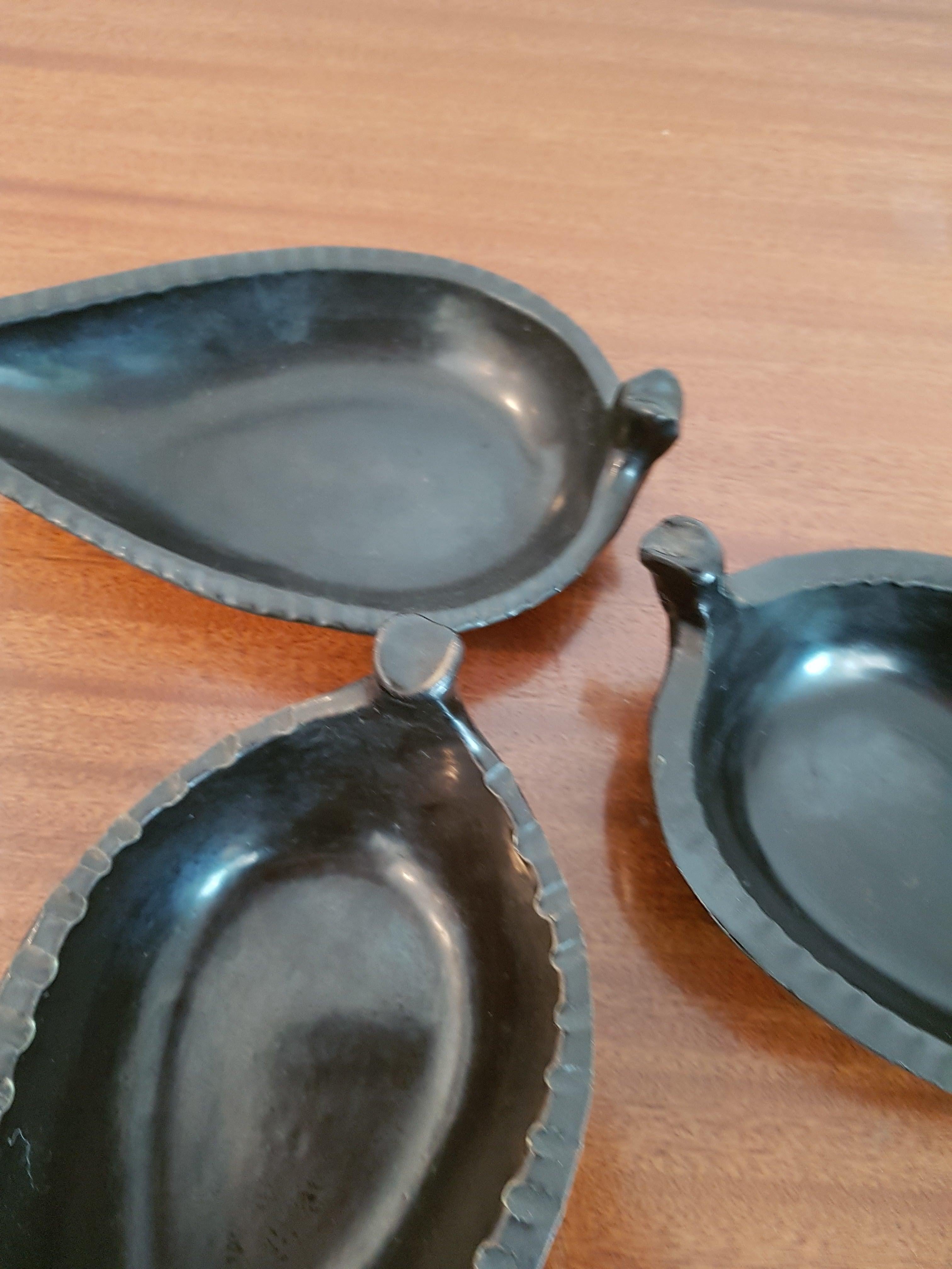 Set of three Mid-Century Modern matte glazed leaf shaped ceramic dishes by Accolay. Signature to base.