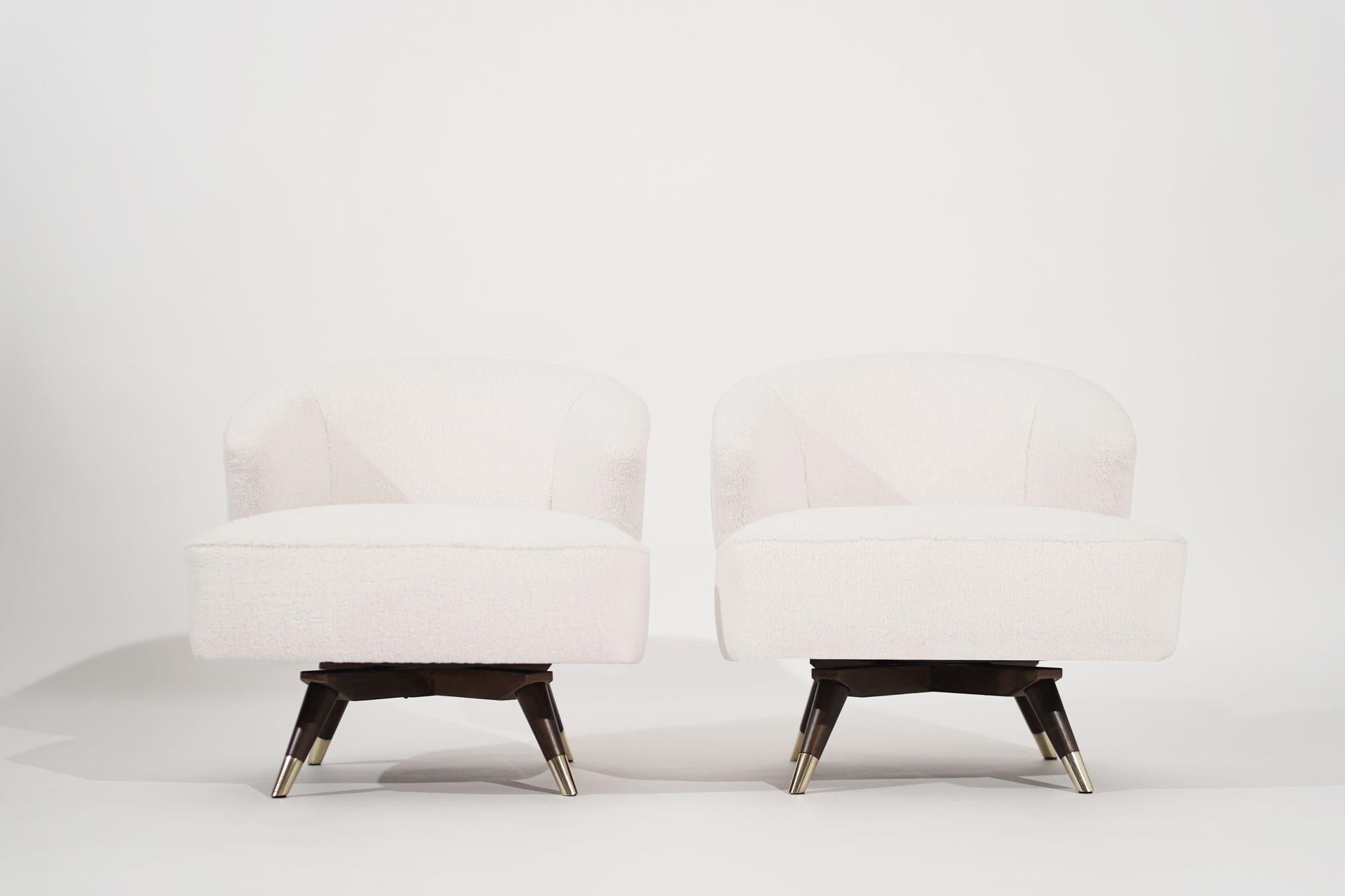 Pair of Mid-Century Modern chairs circa 1950-1959. Expertly restored with exquisite attention to detail by the professional team. These chairs boast a beautiful combination of warm walnut and gleaming brass accents, creating a luxurious and