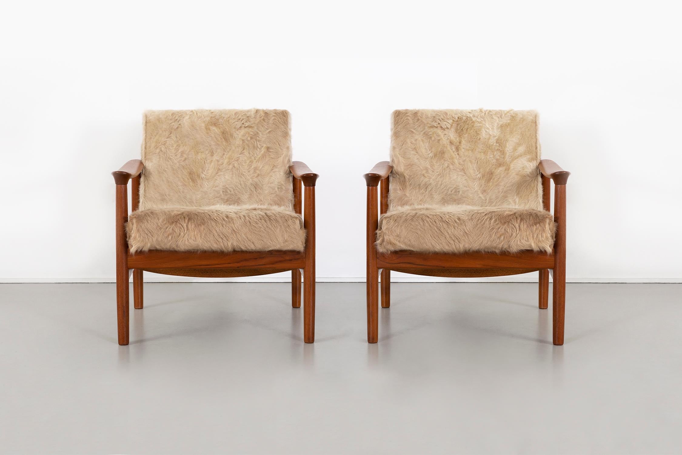 Set of two lounge chairs

designed by Westnofa

Norway, circa 1960s

Freshly reupholstered in long hair Brazilian cowhide with refinished walnut frames 

Measures: 28 ½ H x 25 ? W x 33 ? D x seat 13 ¼ H

Rare set of Westnofa chairs