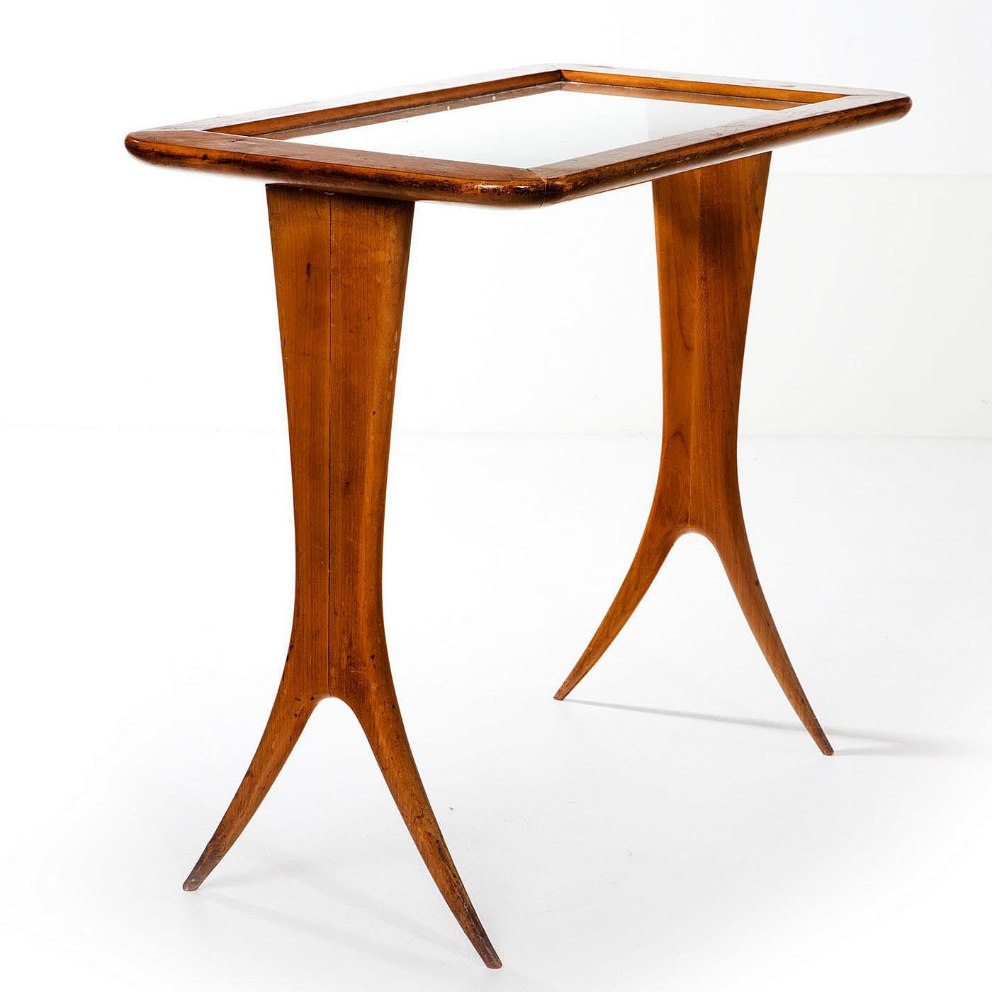 Set of good quality walnut nesting tables with glass tops by Raphael (1912 - 2000). These elegant tables are very sculptural and also eminently usable as they have glass tops so they can also be used for hot drinks. They are very light i so can