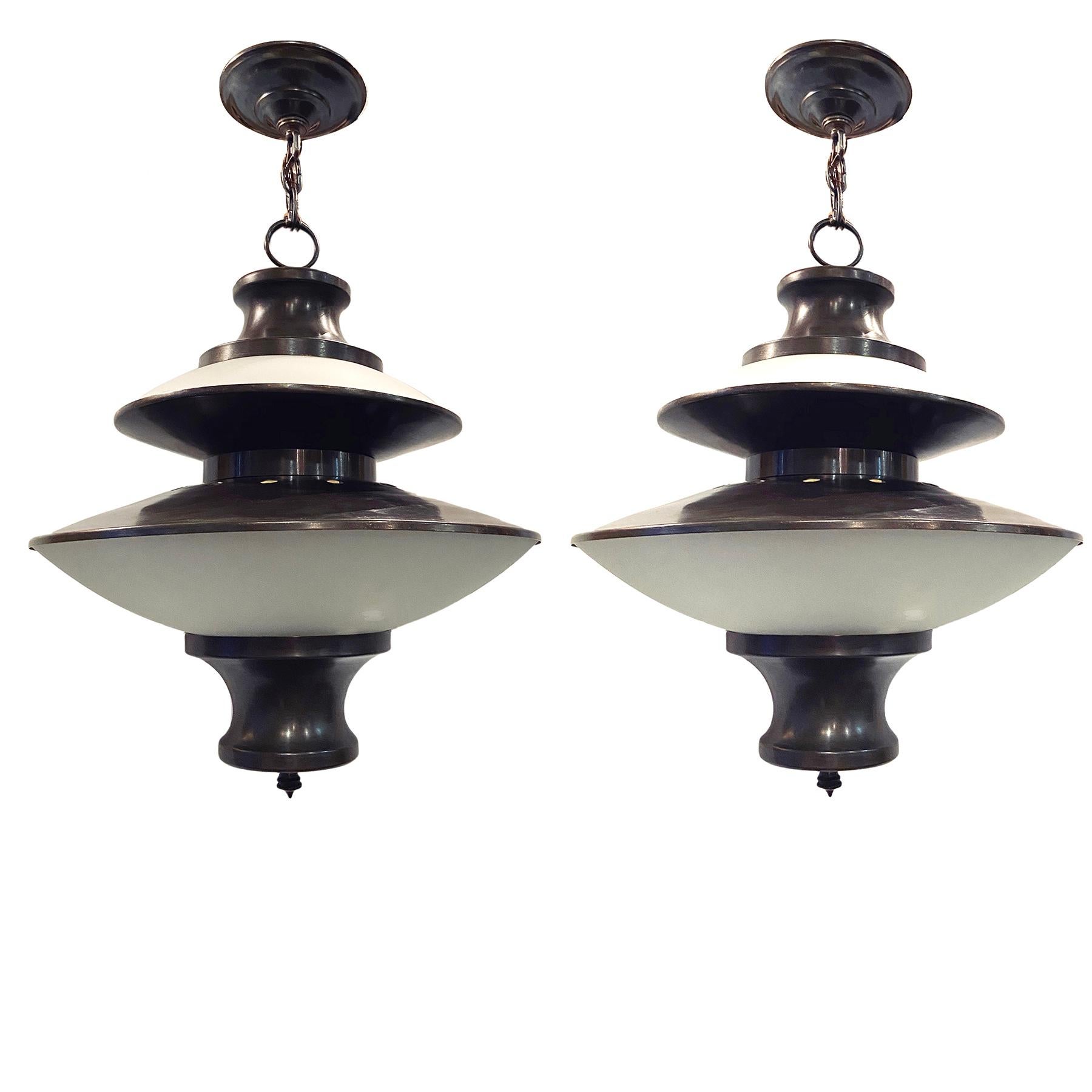 A set of six circa 1950s Italian patinated bronze Italian light fixtures with frosted glass and interior lights. Sold individually.

Measurements:
Diameter: 15