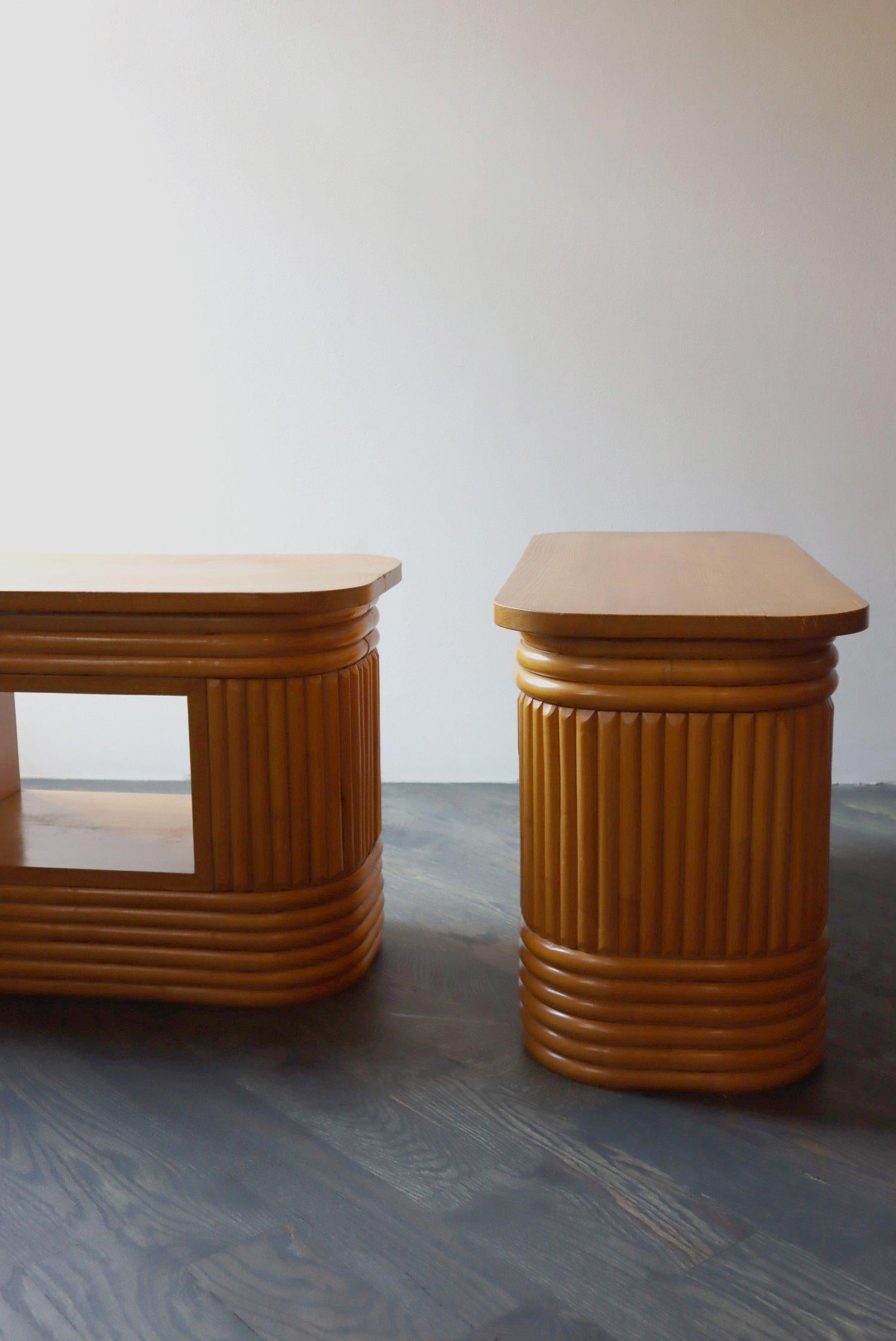 Pair of Midcentury/ Hollywood Regency bamboo oval reeded side tables.  Both are in superb condition.  This fantastic pair can be used indoors or on an outdoor sun porch.

