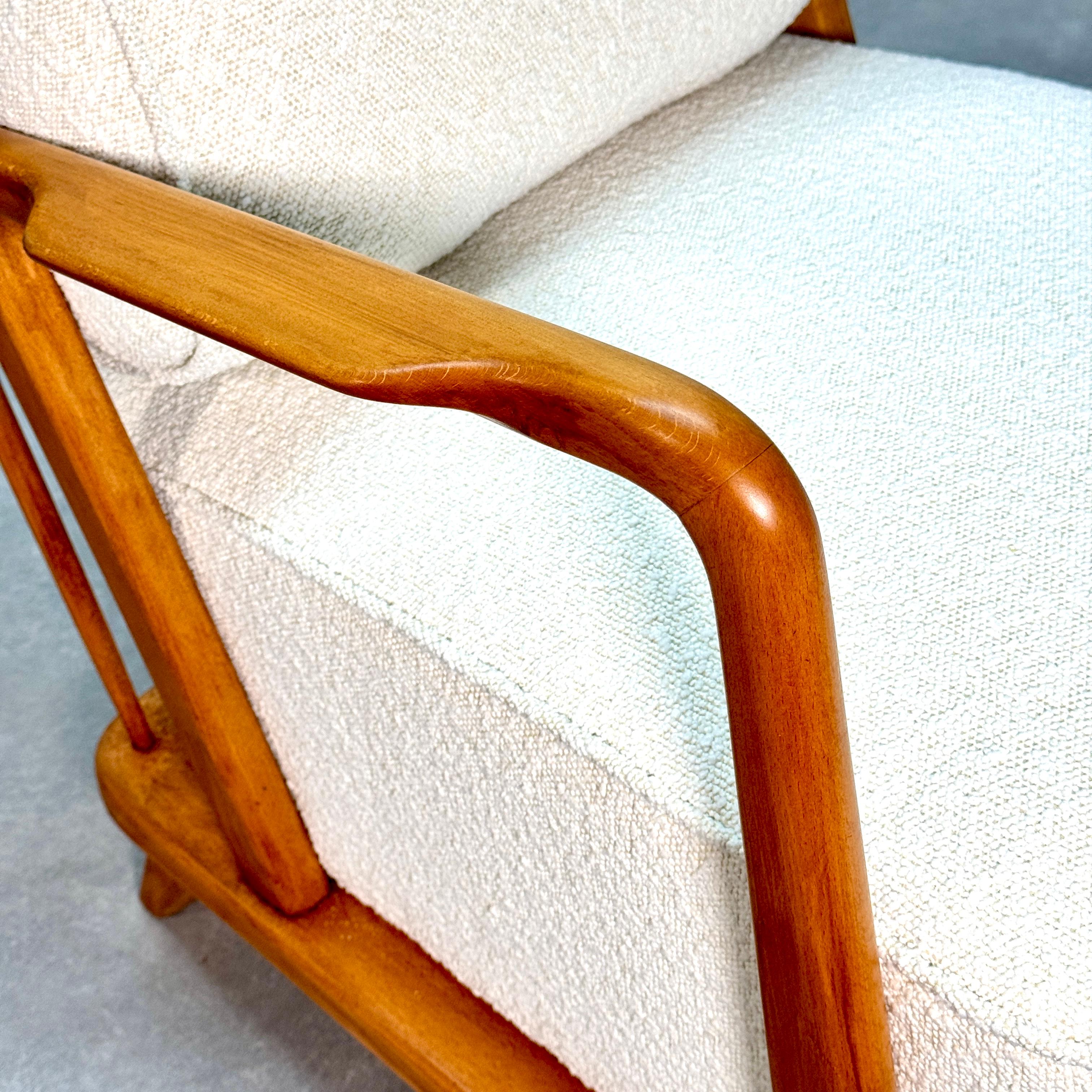 French Set of Mid-Century spindle back cherrywood loungechairs.