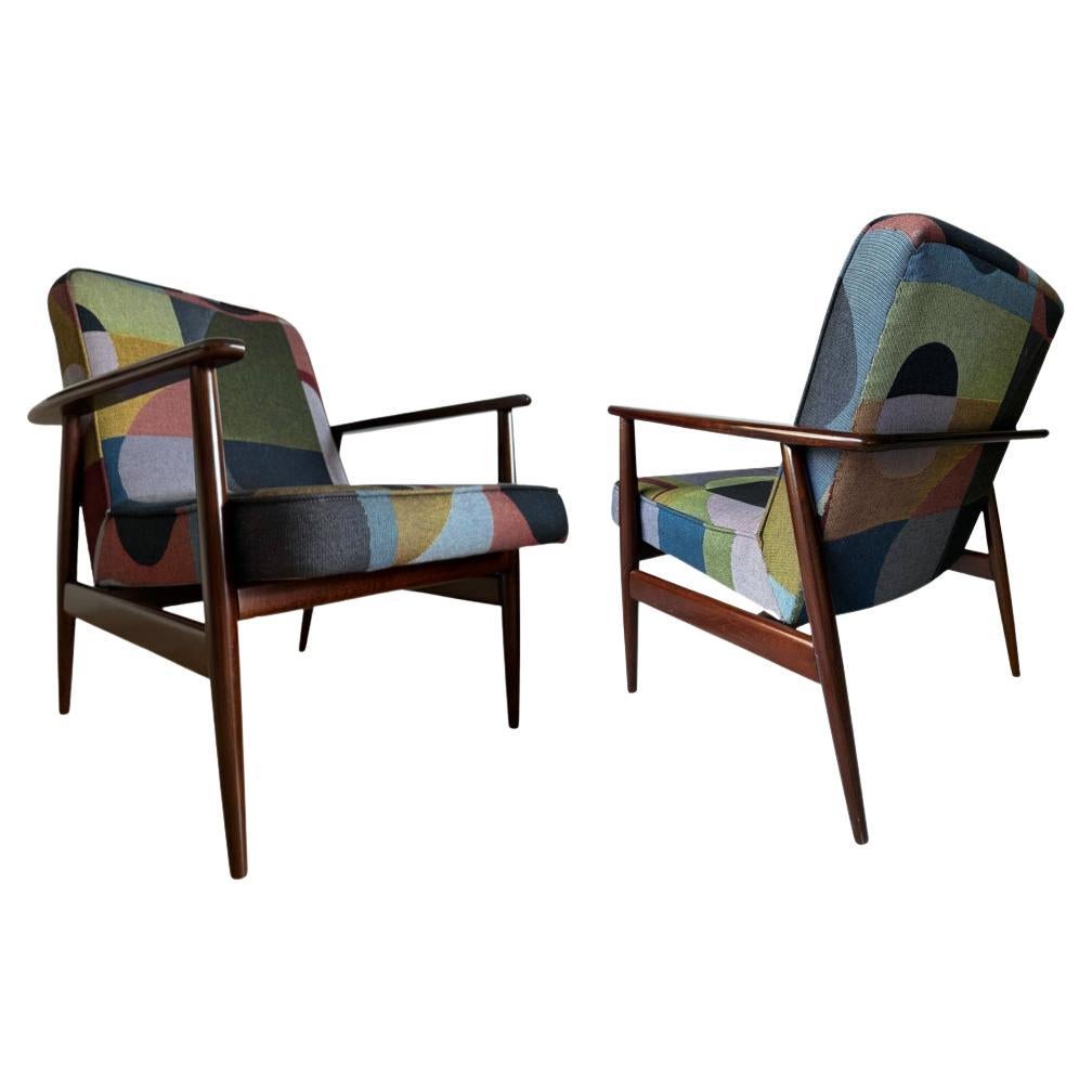 One of the icon of Polish midcentury design, very rare nowadays pair of GFM 300-192 armchairs, designed by Juliusz Kedziorek - the author of many innovative, iconic furniture designs. 

The set has been manufactured by Goscicinska Furniture