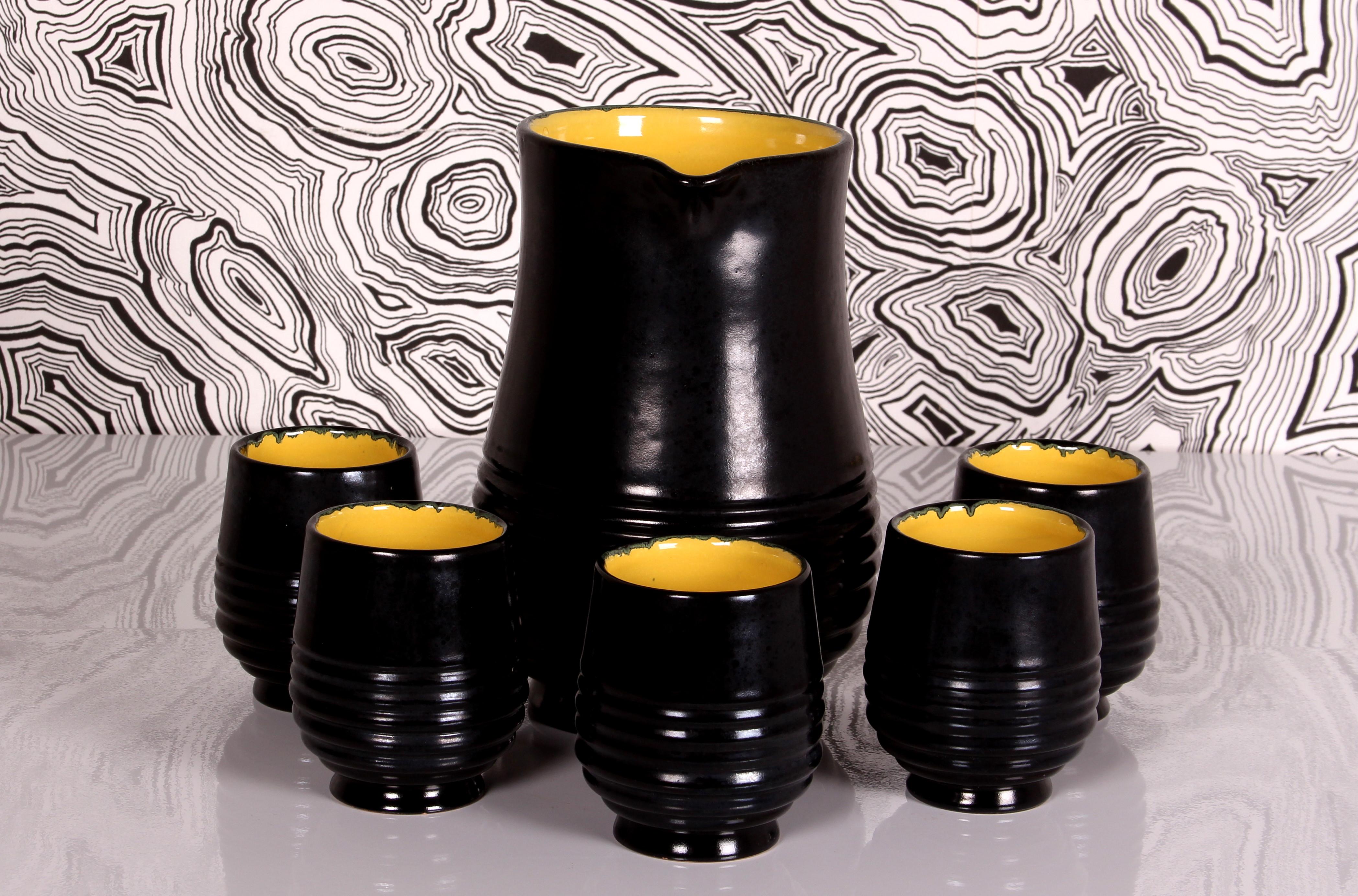 beautiful elegant artful Italian midcentury  
Drinks Set
includes 5 cups 
Famous art pottery from Grottaglie / Puglia Italy
by Ciro Farina

Design Period 	1956 to 1964
Production Period 	around 1960
Country of Manufacture Italy 
MARKED: Grottaglie