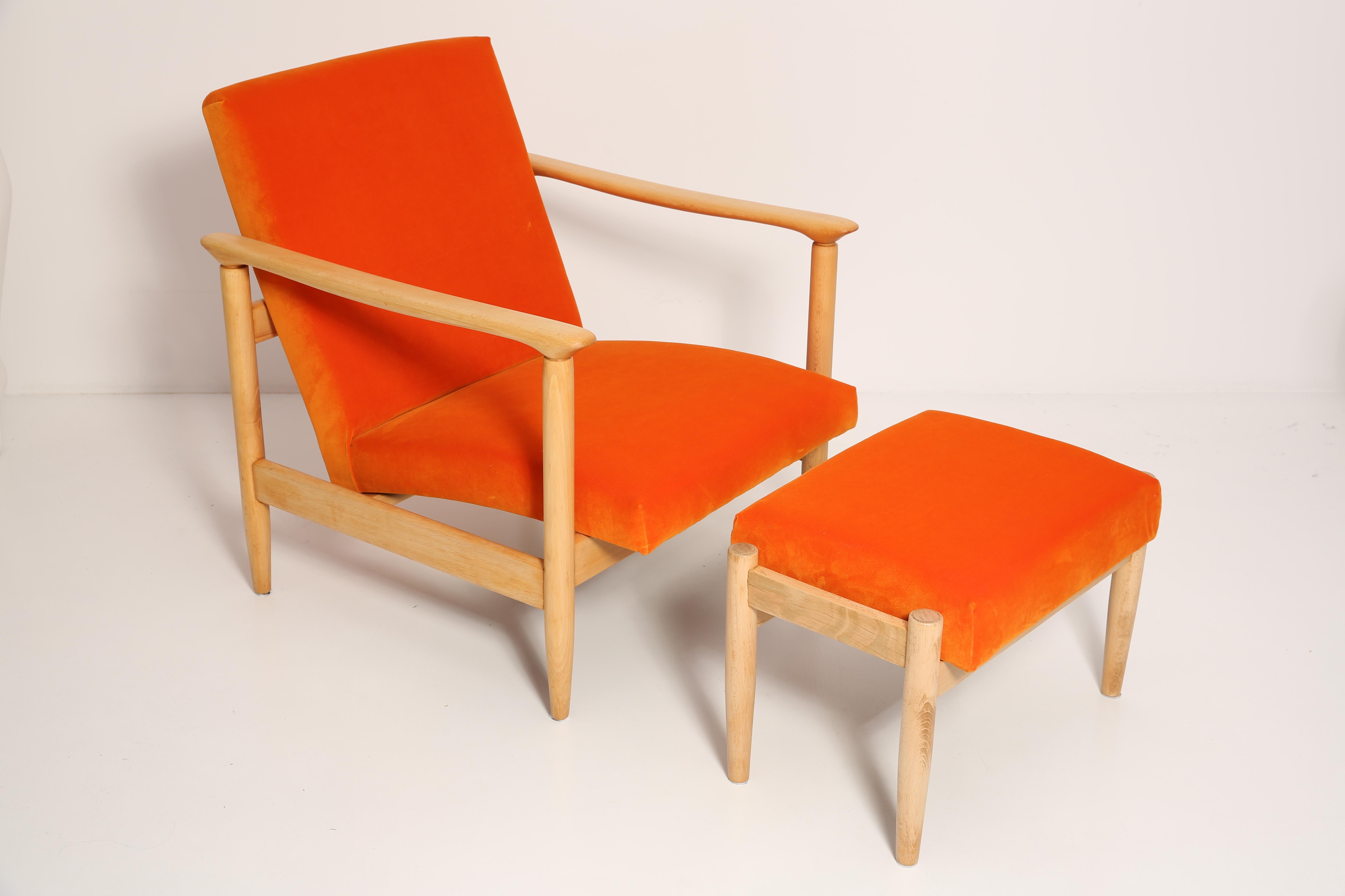 Beautiful bright orange velvet Armchairs GFM-142 and stools, designed by Edmund Homa, a polish architect, designer of Industrial Design and interior architecture, professor at the Academy of Fine Arts in Gdansk. 

The armchairs was made in the