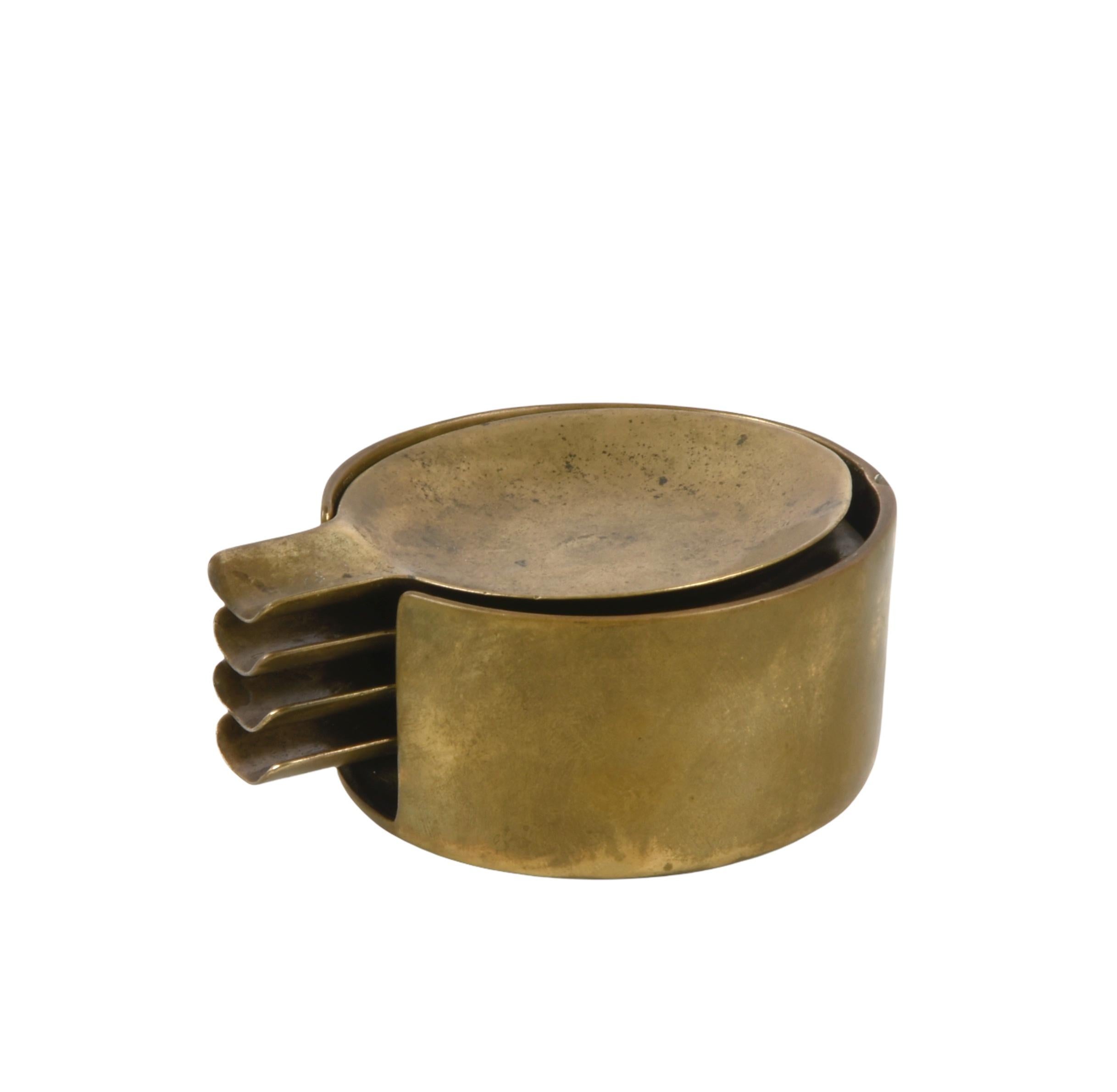 Beautiful set of four stackable ashtrays in solid brass. This set was produced in Austria during the 1950s after Adnet.

This set is magnificent because of the reflection of the solid brass and the four ashtrays that can be stacked into the main