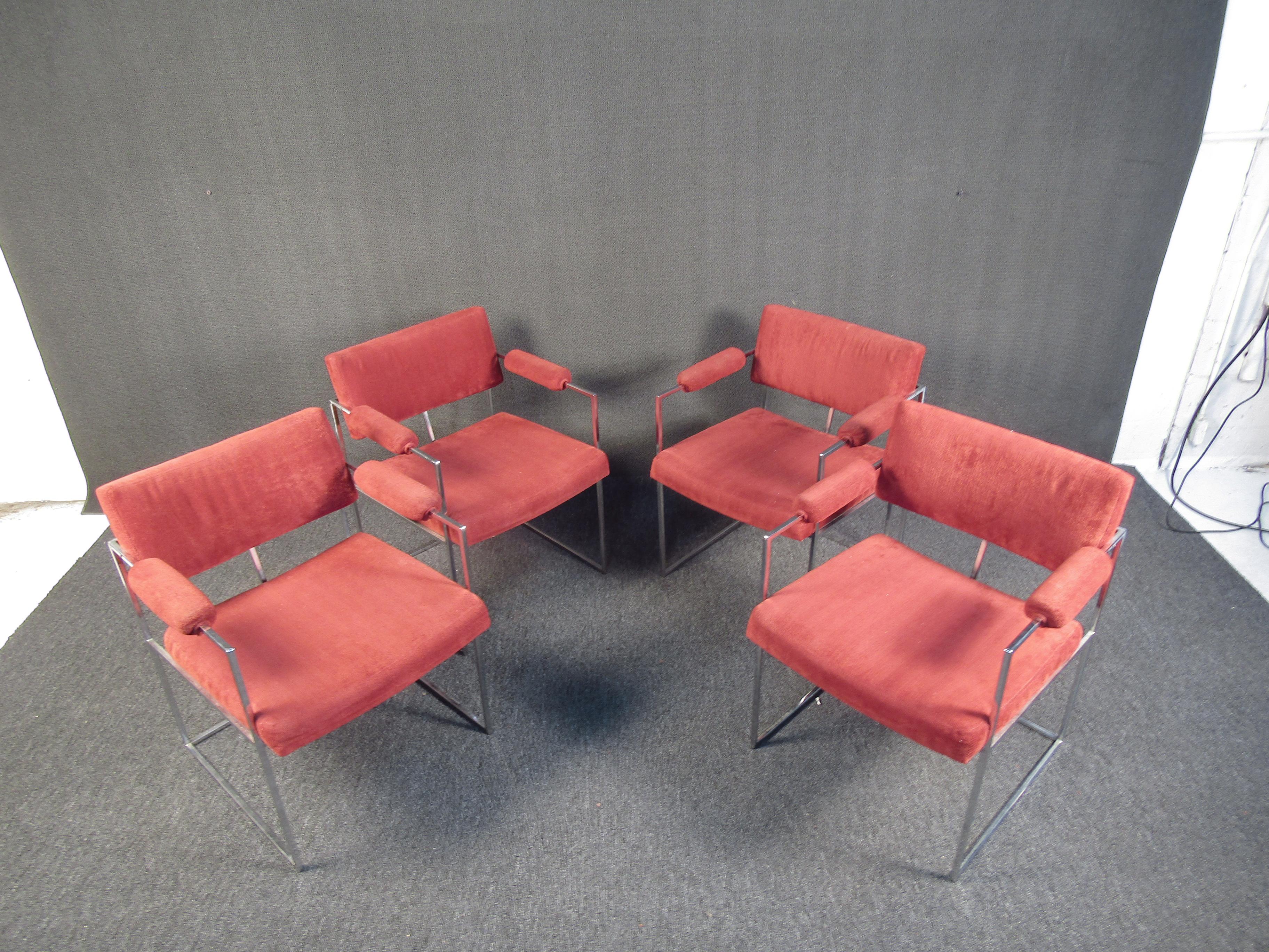 This stunning set of chairs by Marlo Baughman feature clean chrome bases, and plush upholstery seats. With style and functionality, these chairs will bring together any space without overpowering the rest of the room. Please confirm the item