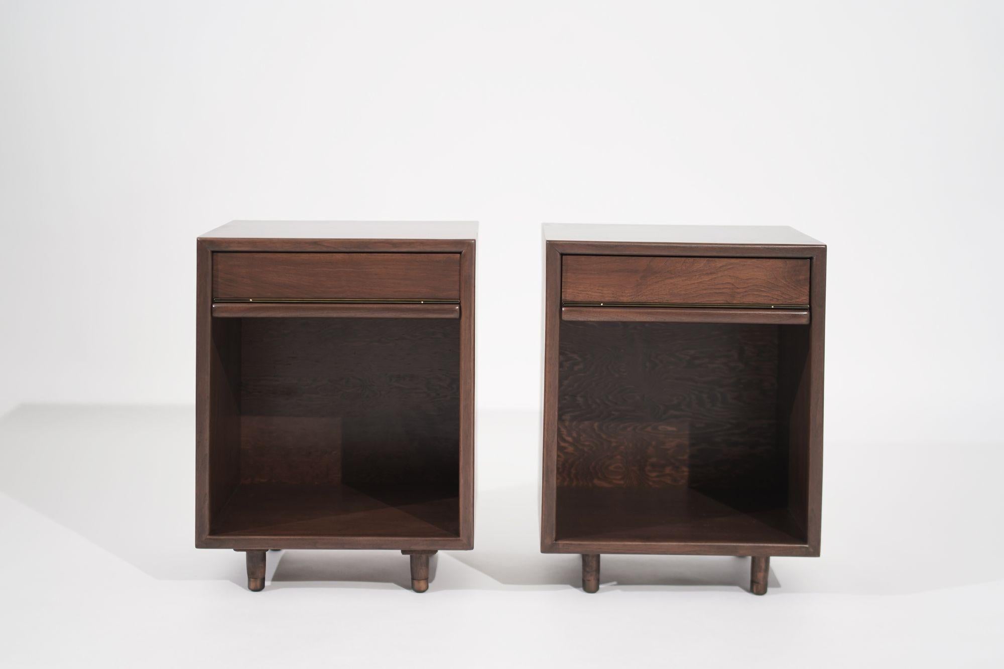 Exceptional pair of minimalist nightstands, expertly crafted in walnut to bring a touch of understated elegance to your bedroom. These nightstands seamlessly blend form and function, combining clean lines and minimalist design with thoughtful