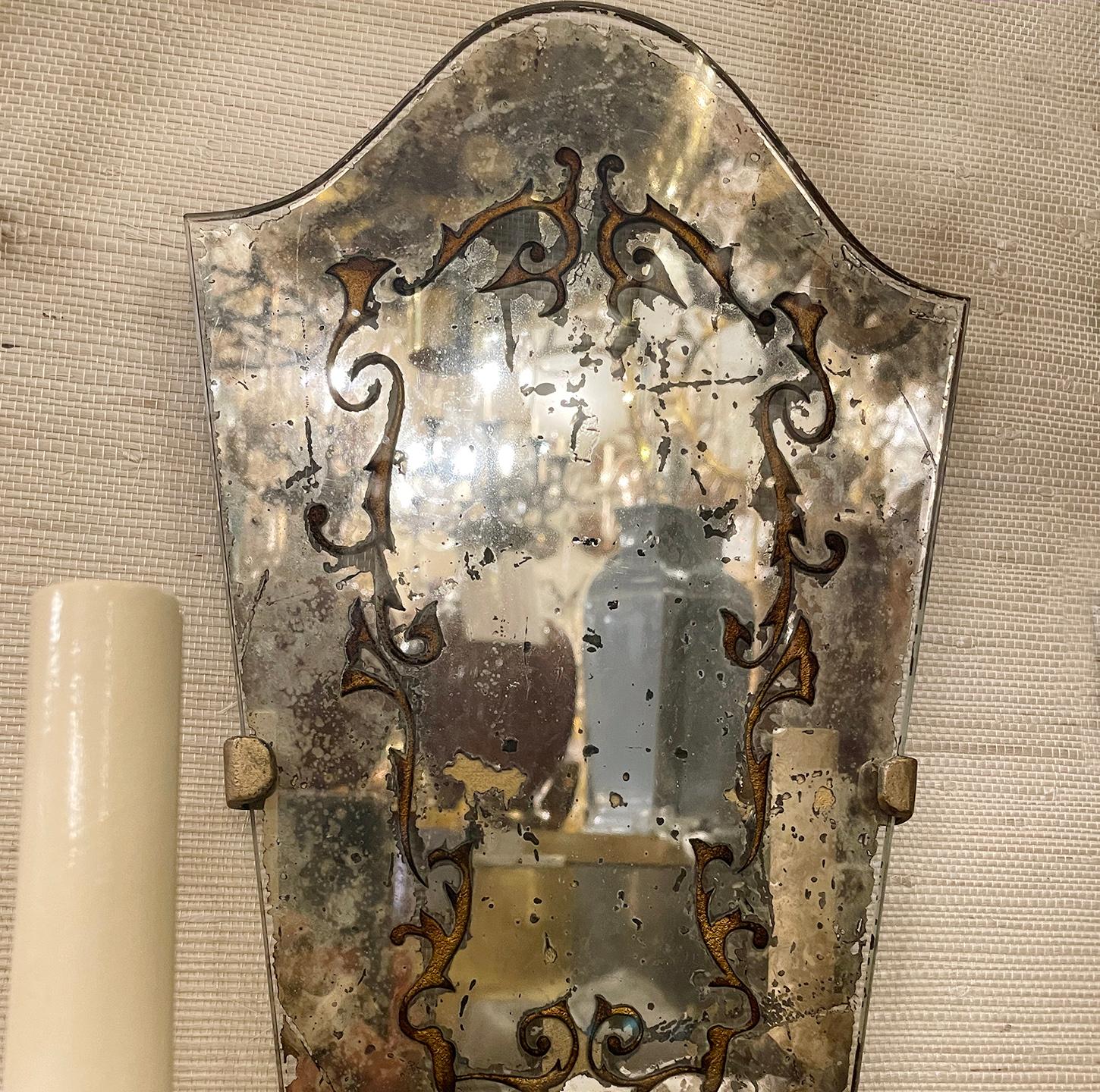 Set of three mirrored sconces with gilt details etched on mirror. Sold individually.

Measurements:
Height: 15