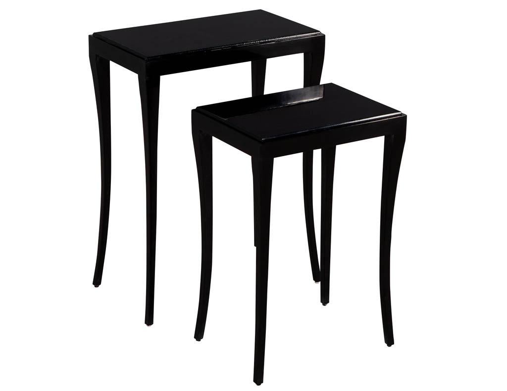 Set of modern black nesting tables. Modern Deco inspired featuring mahogany woods and sleek curved legs. Custom finished in hand polished black lacquer. Also available in white.

Price includes complimentary curb side delivery to the continental