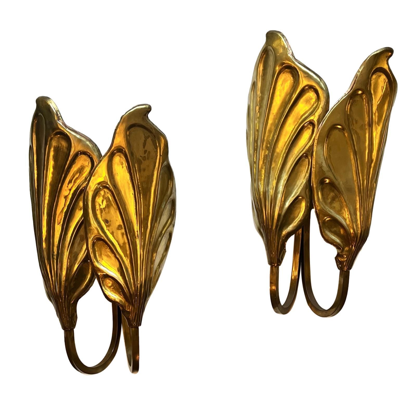 Set of eight circa 1960's Italian hammered and polished bronze leaf motif art nouveau style double light sconces. Sold per pair.

Measurements:
Height: 15.5