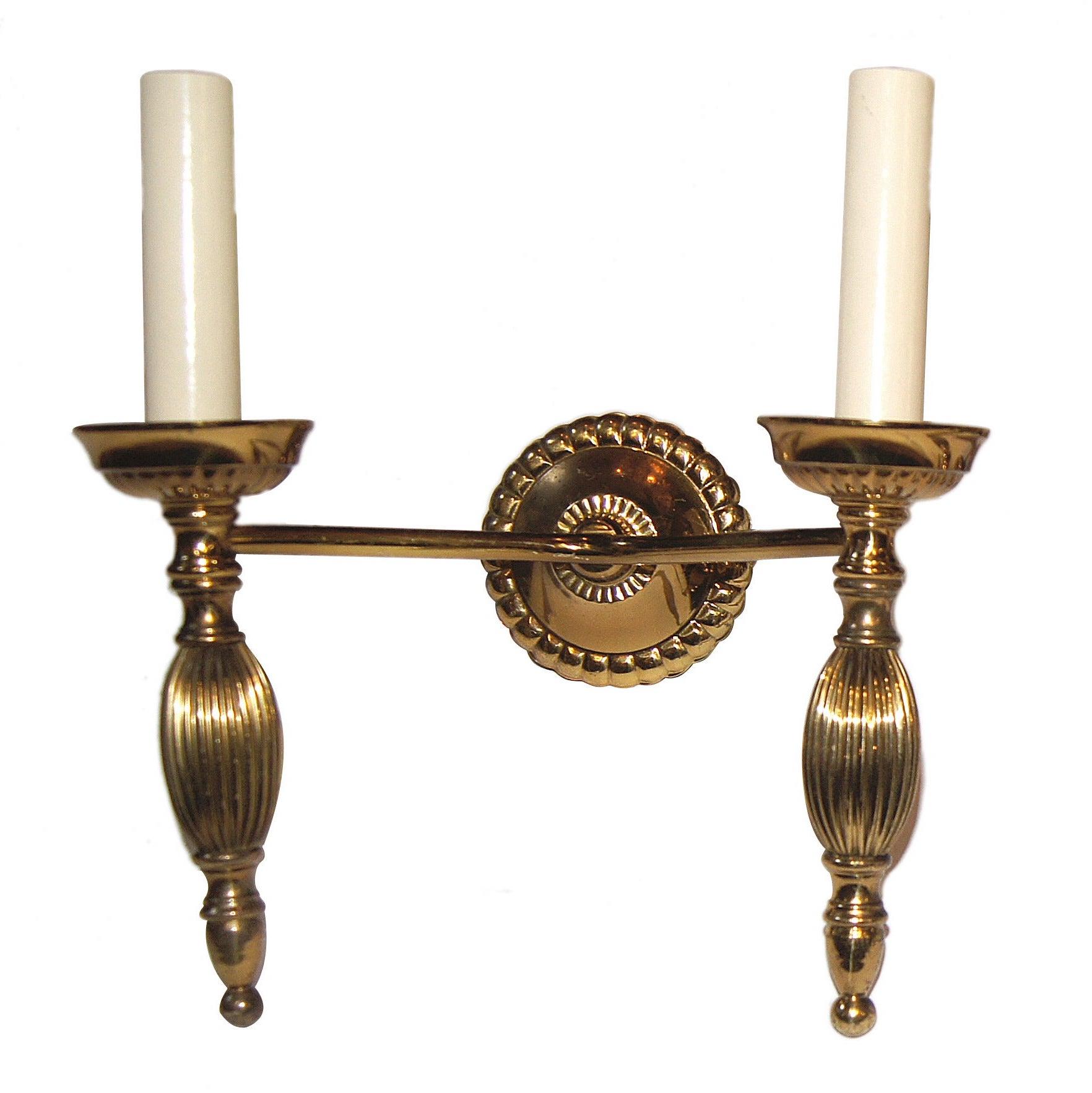 Set of eighteen circa 1940's Italian gilt metal two-arm sconces. Sold per pair.

Measurements:
Height: 9.5