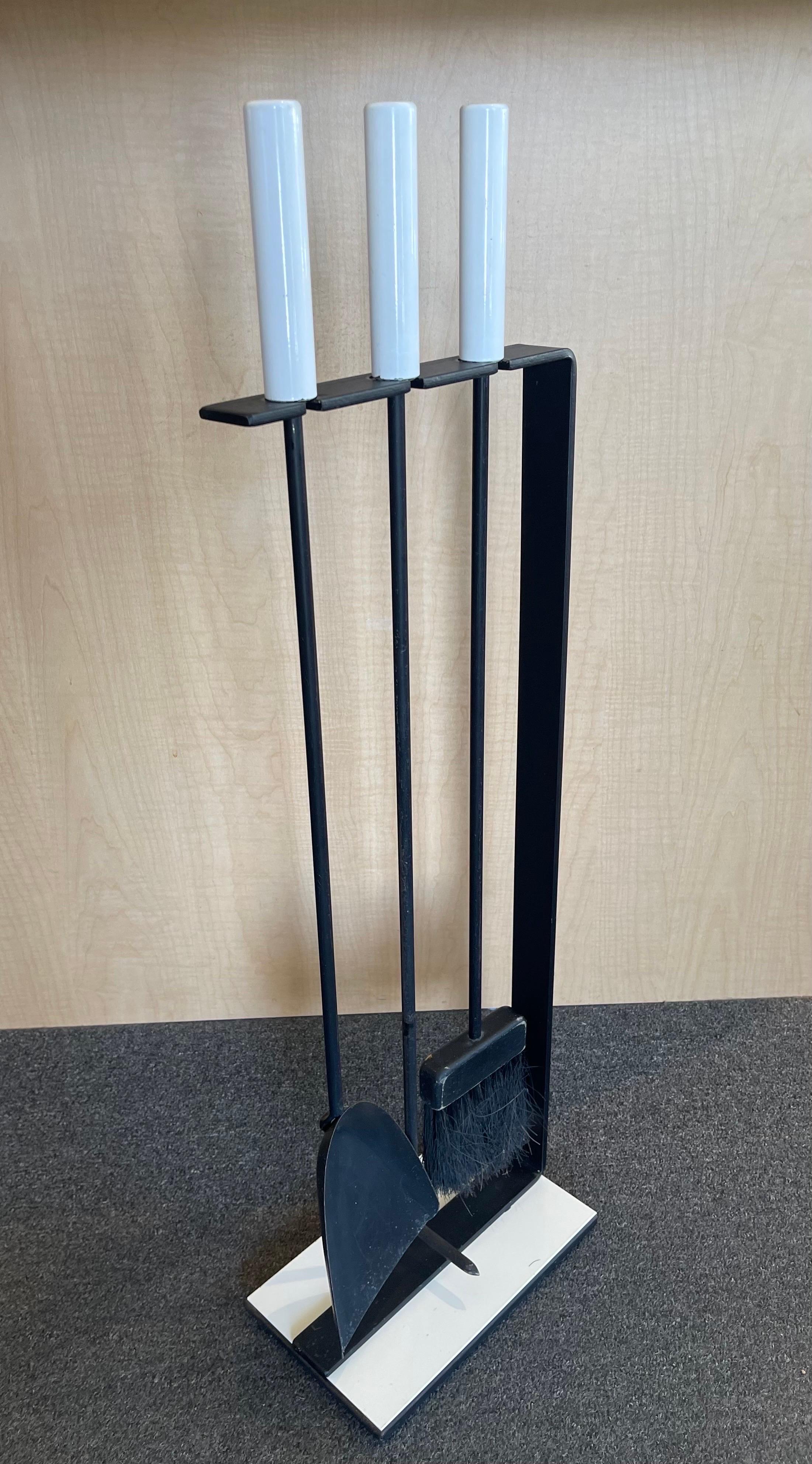 Set of modernist fireplace tools with white enamel handles by Pilgrim, circa 1960s. There are three tools (shovel, brush and poker) and a single stand in good vintage condition. The set is very heavy and well made; it measures: 10