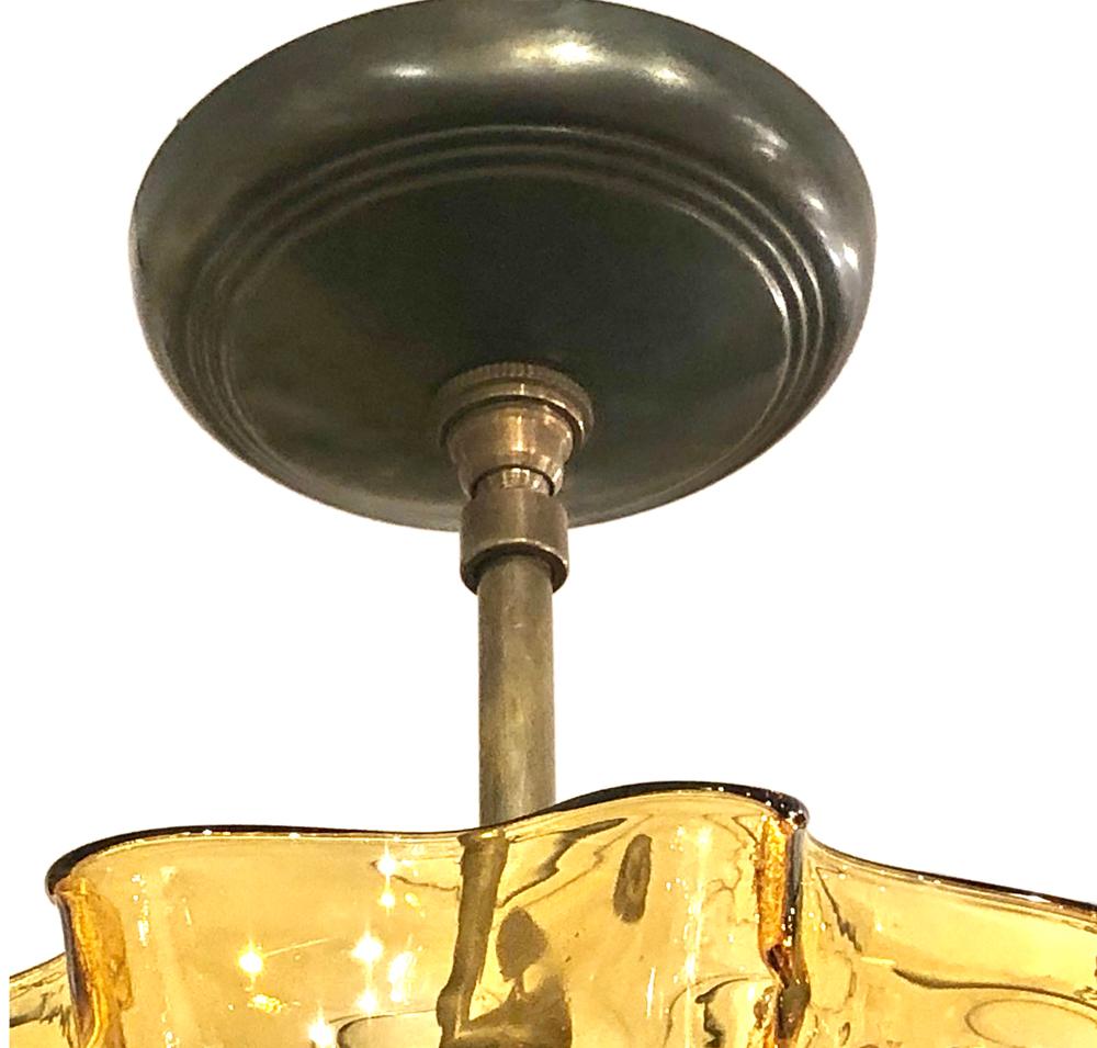 French Set of Molded Amber Glass Light Fixtures, Sold Individually For Sale