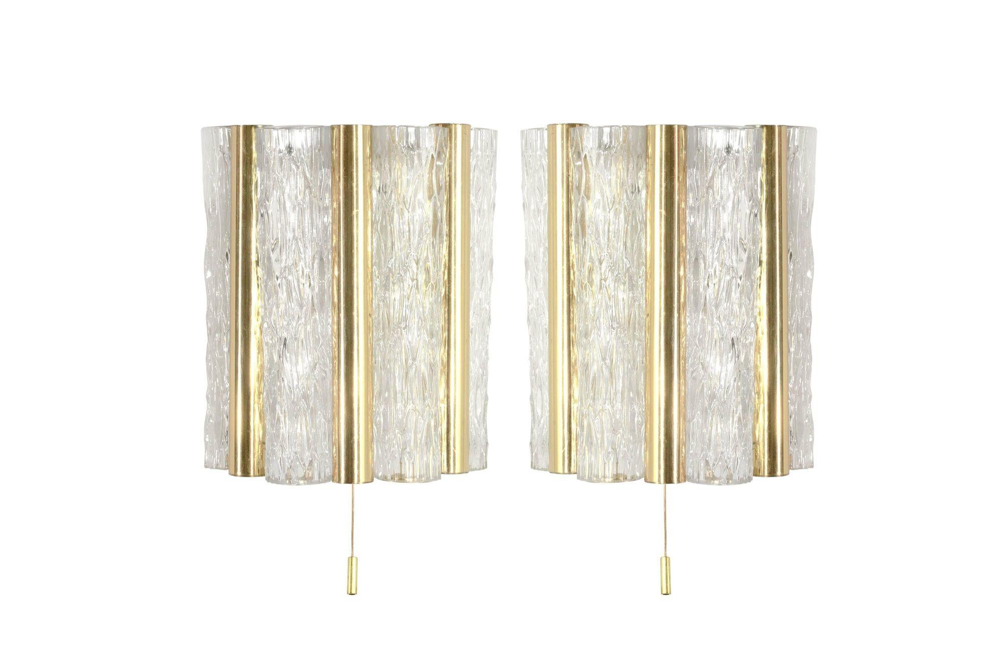Meticulously restored Murano Glass and Brass Sconces by Doria Leuchten, crafted in Germany circa the 1960s. These elegant pieces showcase the epitome of mid-century modern design, marrying exquisite Murano glass craftsmanship with refined brass