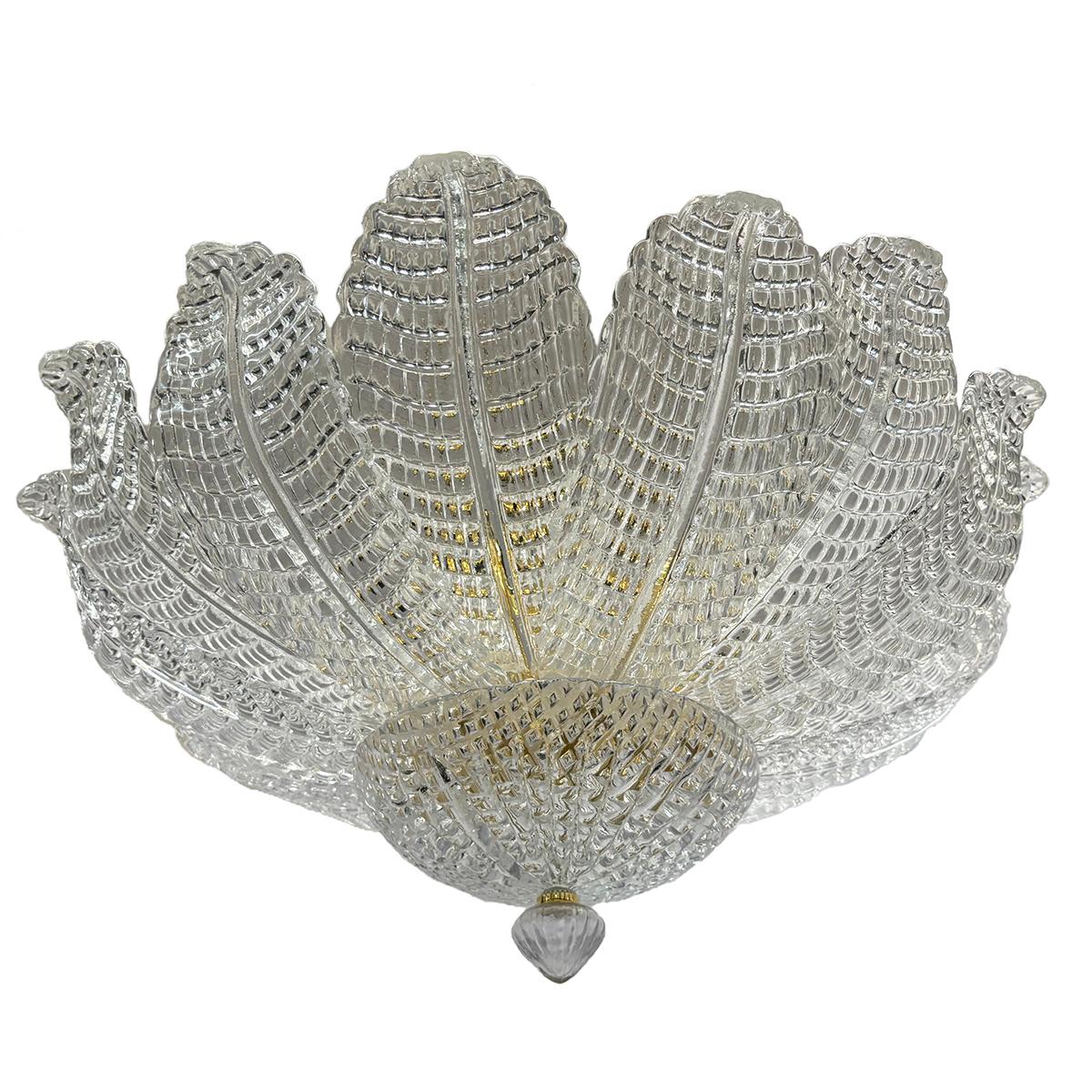 Set of 4 Italian circa 1950’s Murano glass flush mounted fixtures with interior lights.  Body in the shape of leaves. Priced, and sold individually.

Measurements:
Diameter: 27″
Drop: 12″