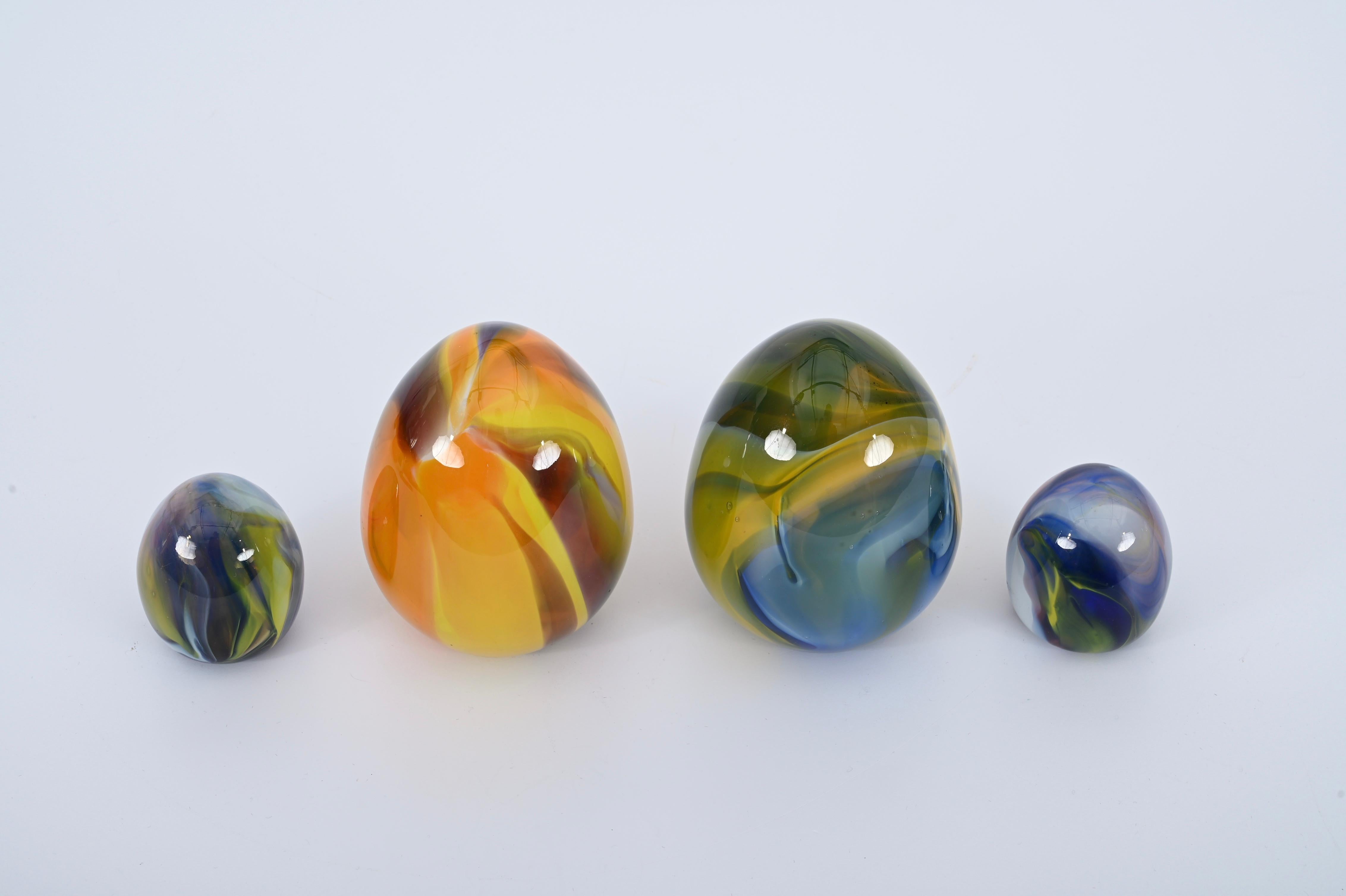 Incredibly rare set of four murano blown glass egg sculptures, attributed to Archimede Seguso, Italy 1970s.

This astonishing set, heavily spatialism inspired, is composed by two pair of eggs, featuring incredibly vibrant colors that blend one