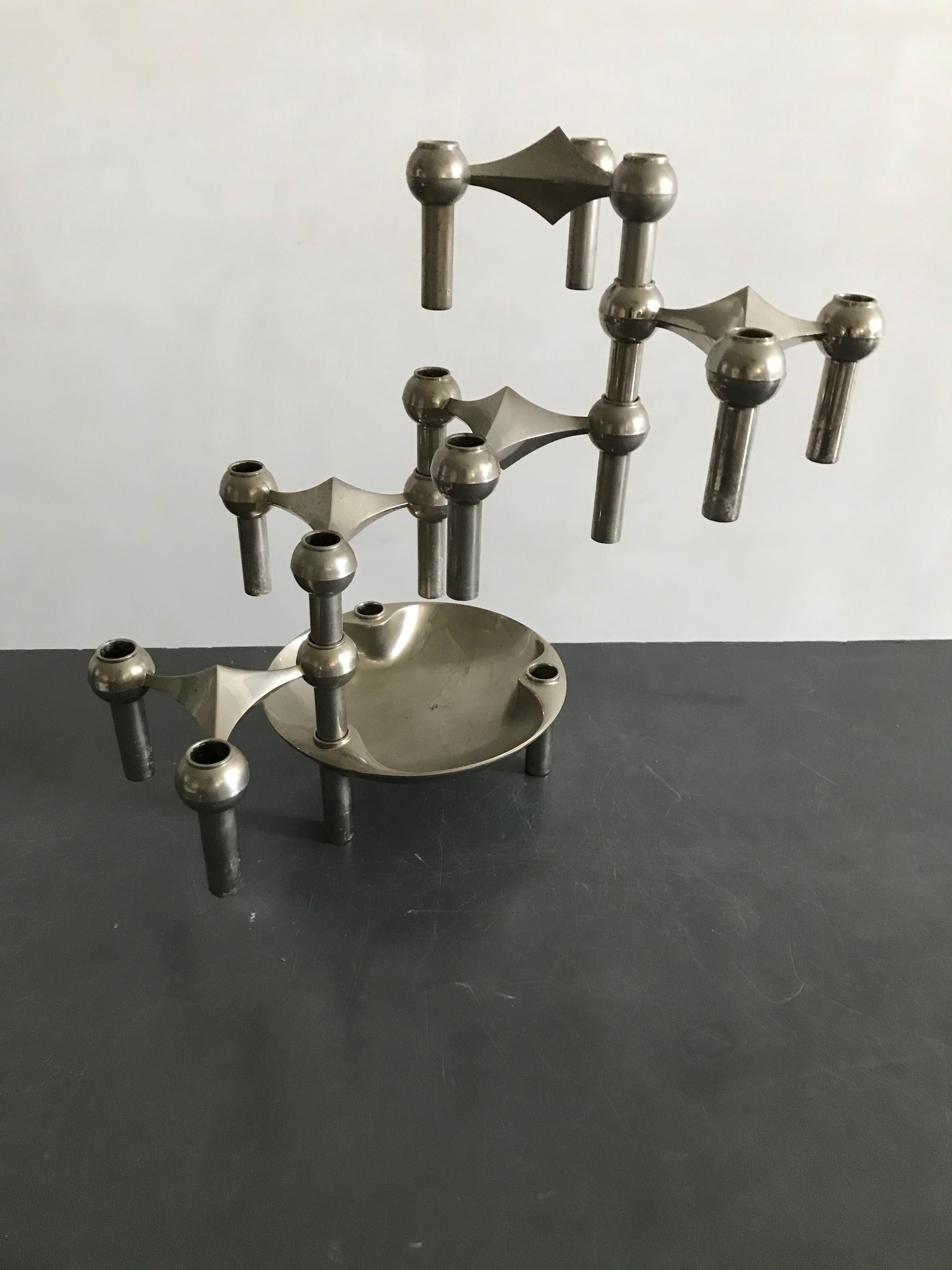 A Classic Nagel candleholder set, with a rare dish. The set holds 5 candle segments and a dish. It can be configured in various number of ways, as well vertically as horizontally by stacking the interlocking pieces. 

   