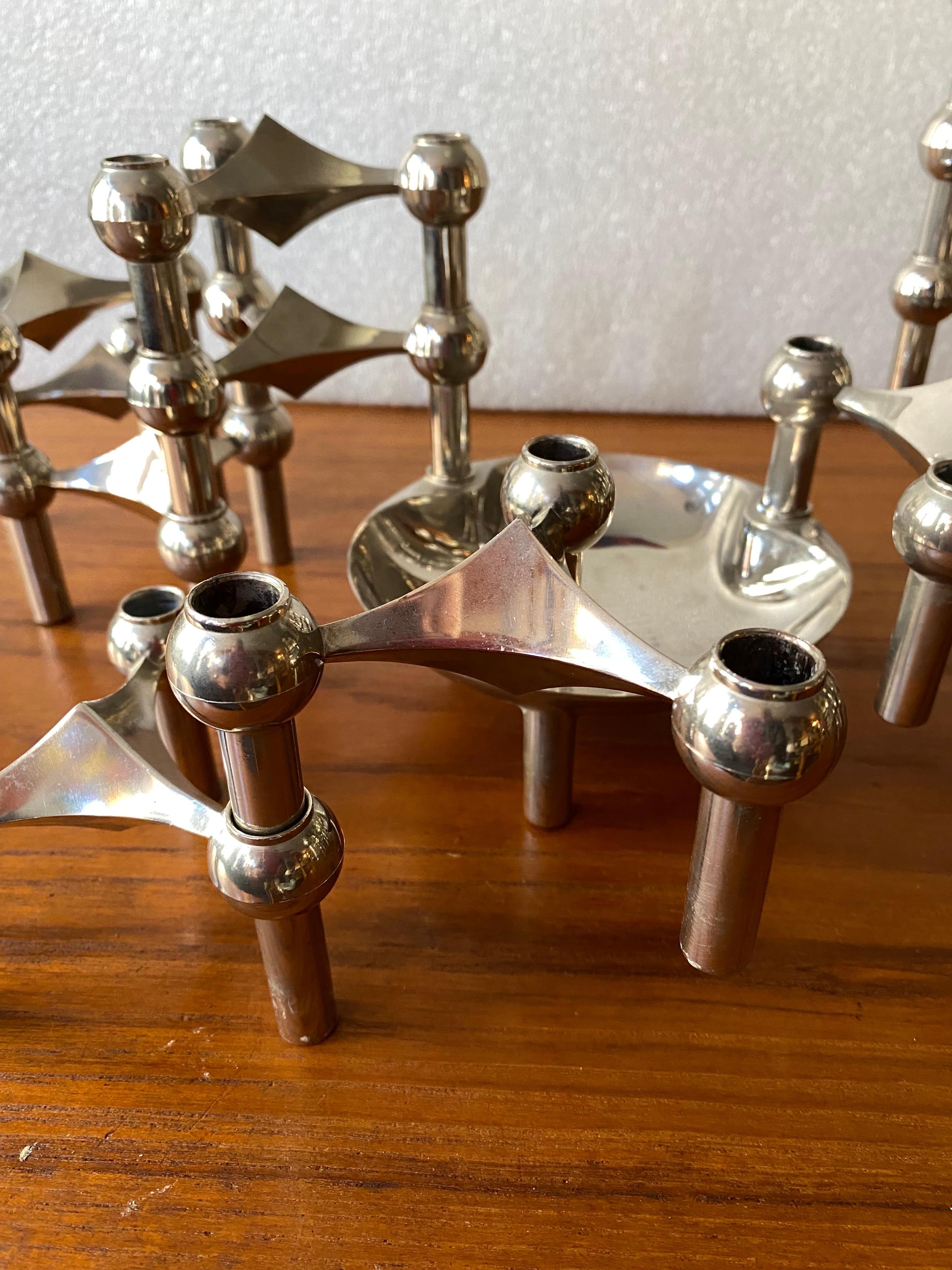 Large Grouping of Nagel and Stoffi Candlsticks with one bowl. 21 pieces in all allows for multiple configurations and designs! Metal with a nickel plated finish. Overall very clean example! The bowl piece shows a little wear in center. As shown in