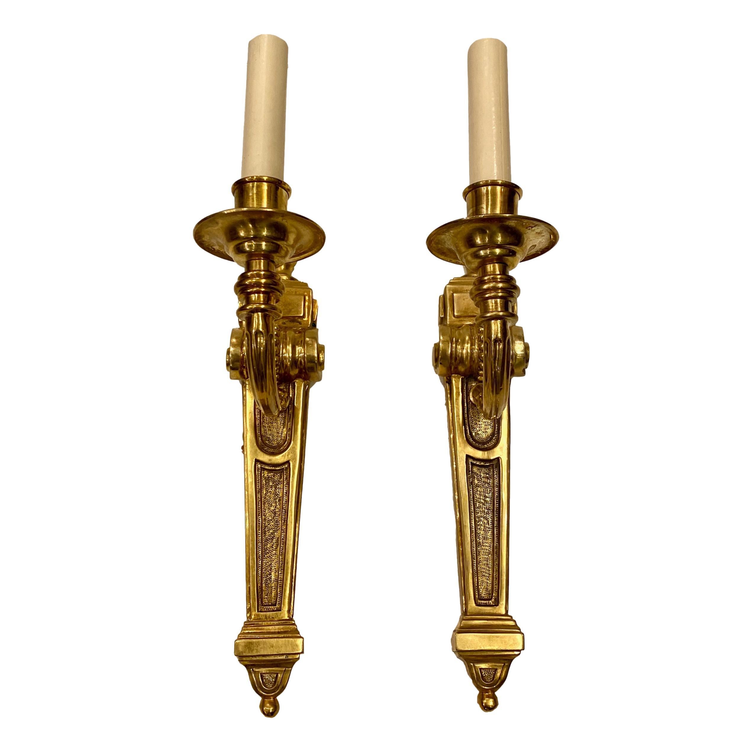 A set of four French circa 1940's neoclassic style single light sconces with original gilt finish. Sold per pair.

Measurements:
Height: 15