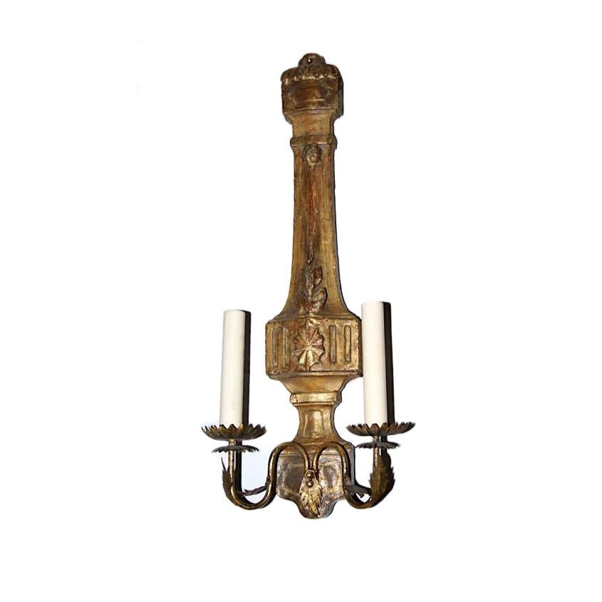 Set of four Italian circa 1900 neoclassic style two-arm carved and giltwood sconces with foliage motif on body and gilt metal arms. Sold per pair.

Measurements:
Height 21