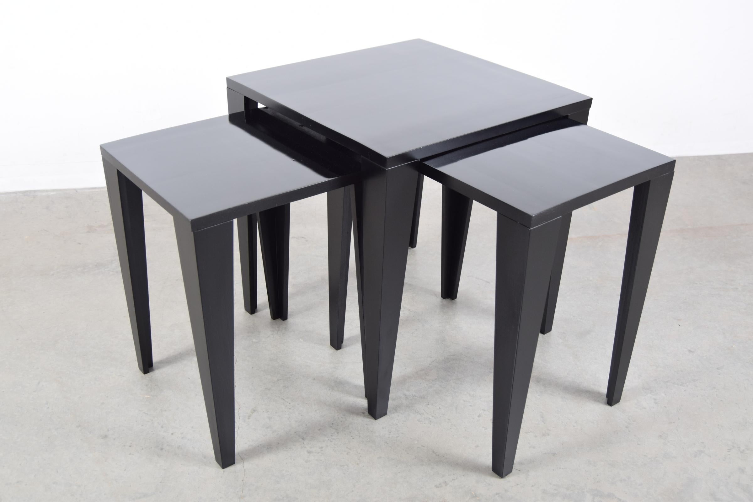 Set of nesting tables in black lacquer, designed by Fran Hosken. Produced by Hosken, Inc., circa 1950.

Tables measure as follows: Large: 20