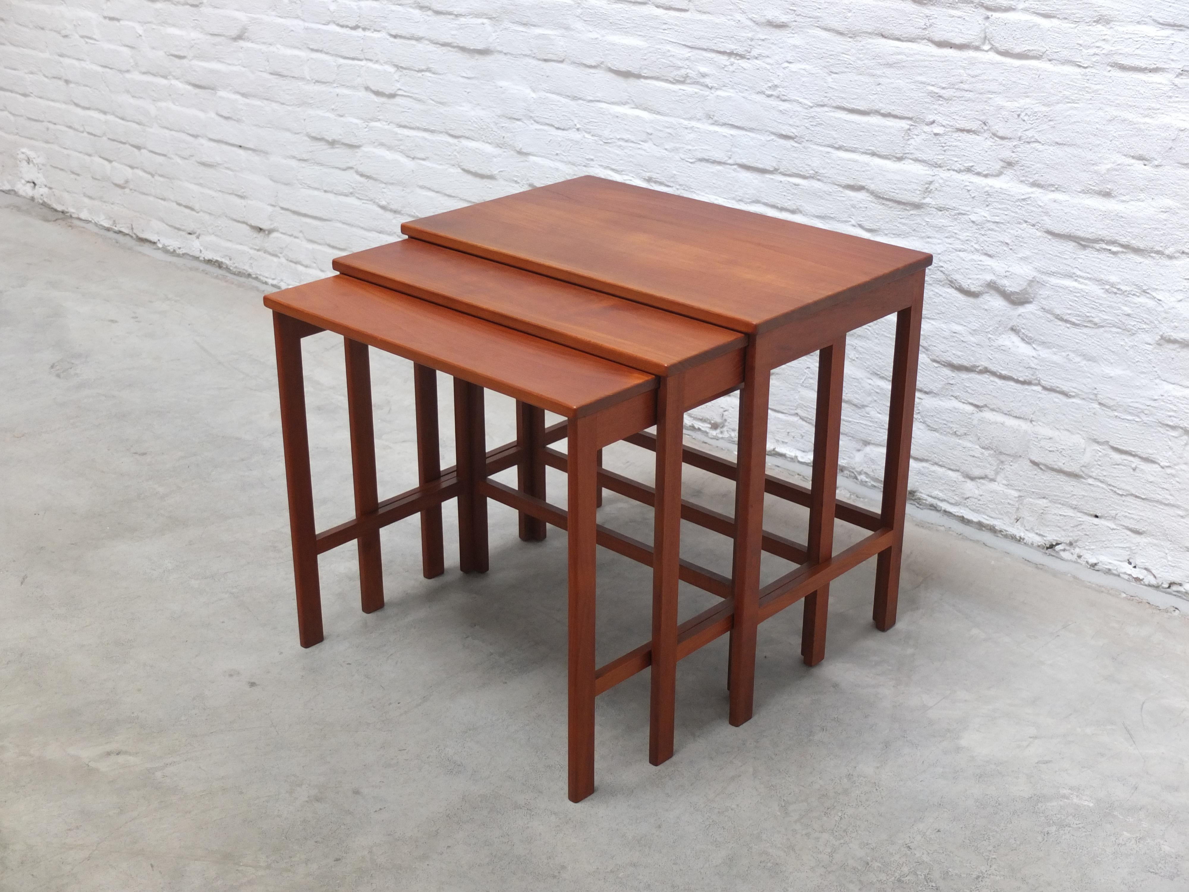 Beautiful set of nesting tables designed by Peter Hvidt & Orla Mølgaard-Nielsen for France and Son, 1950s. This set features three tables that slide into each other. Made of solid teak wood and in very good condition. A very fine Danish Modern