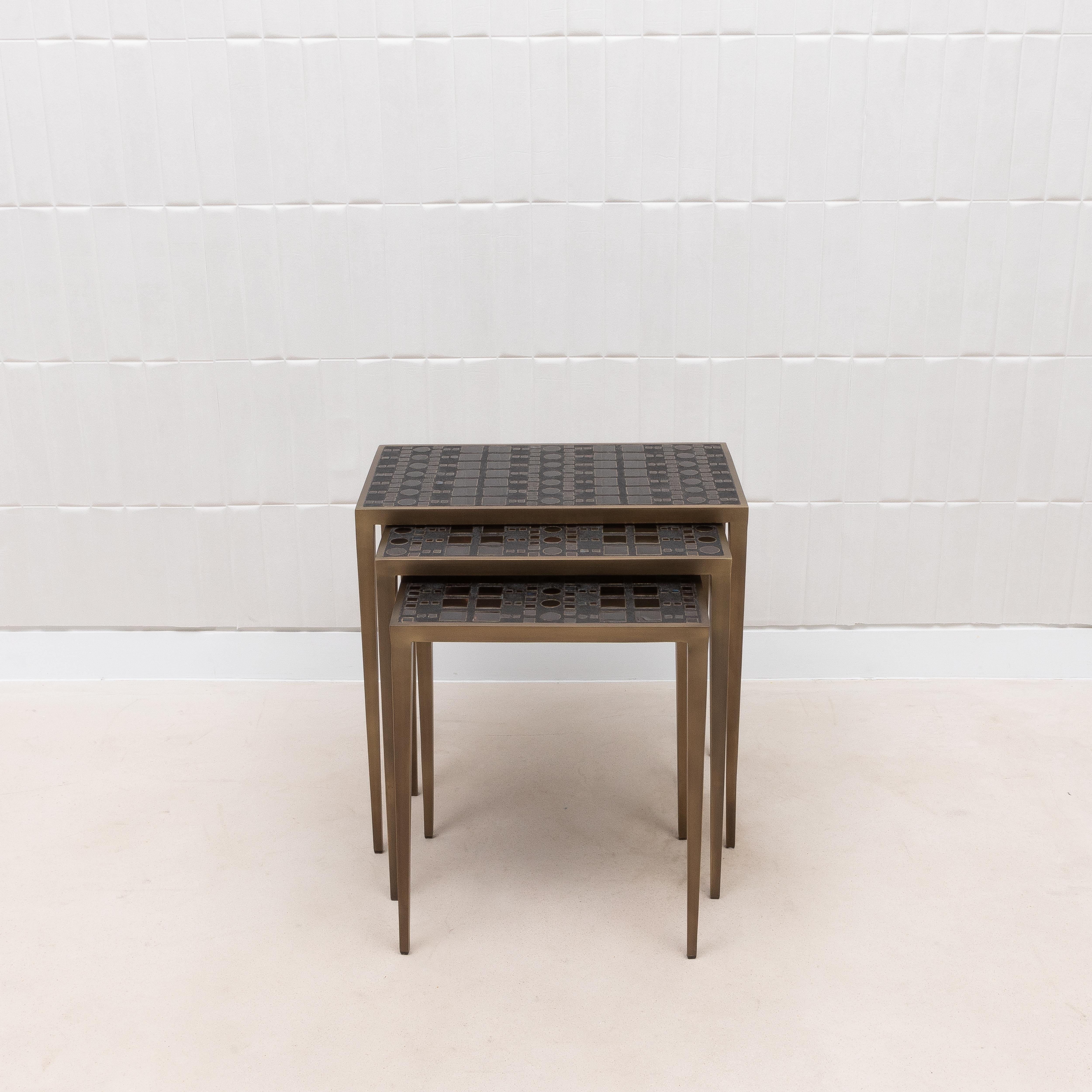 Inspired by the opulent mosaics of Gustav Klimt, this set of three nesting tables by R&Y Augousti is a testament to the art of fine craftsmanship. Each table is meticulously hand-crafted, featuring an intricate inlay of black shagreen and polished
