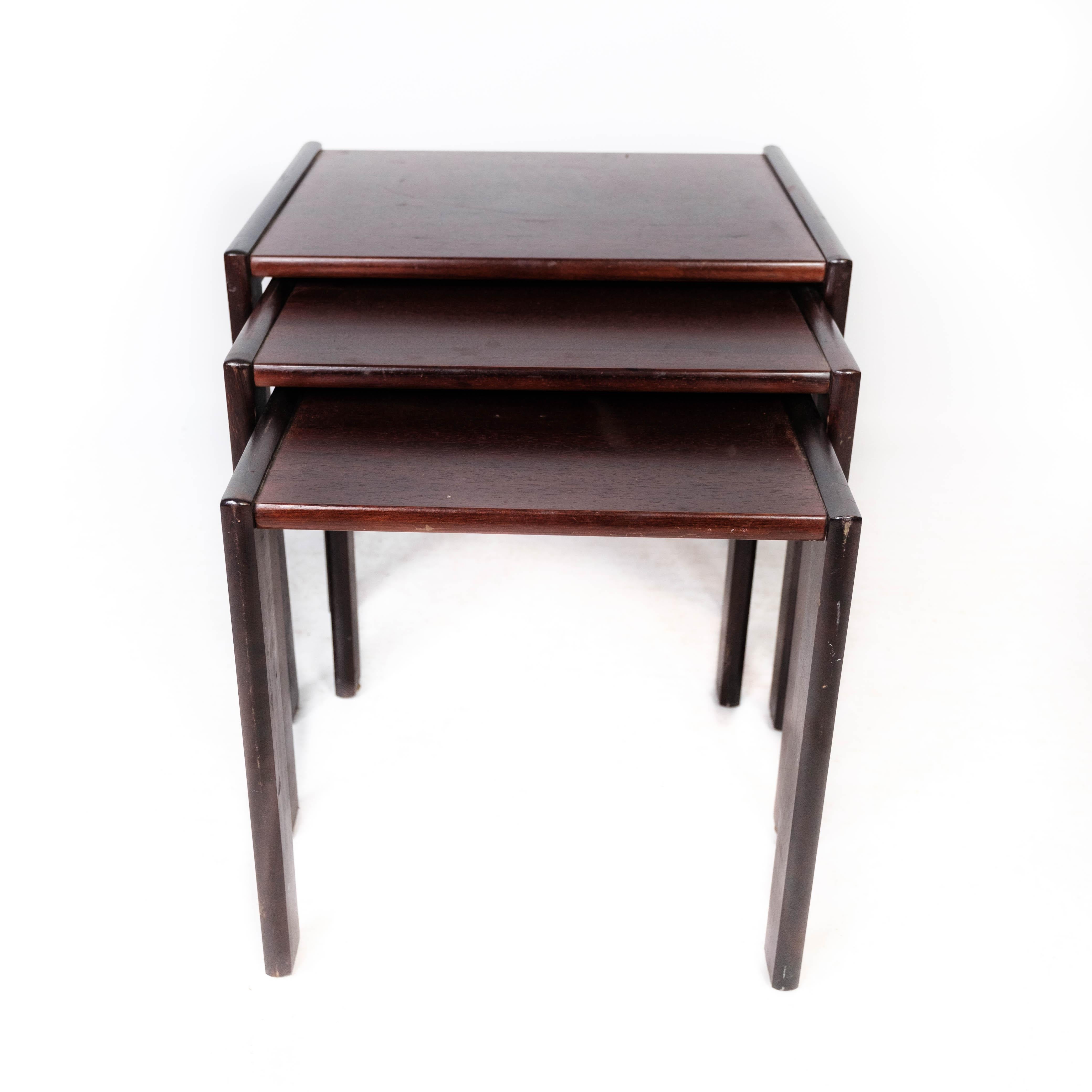 Set of nesting tables in dark wood of Danish design from the 1960s. The tables are in great vintage condition.