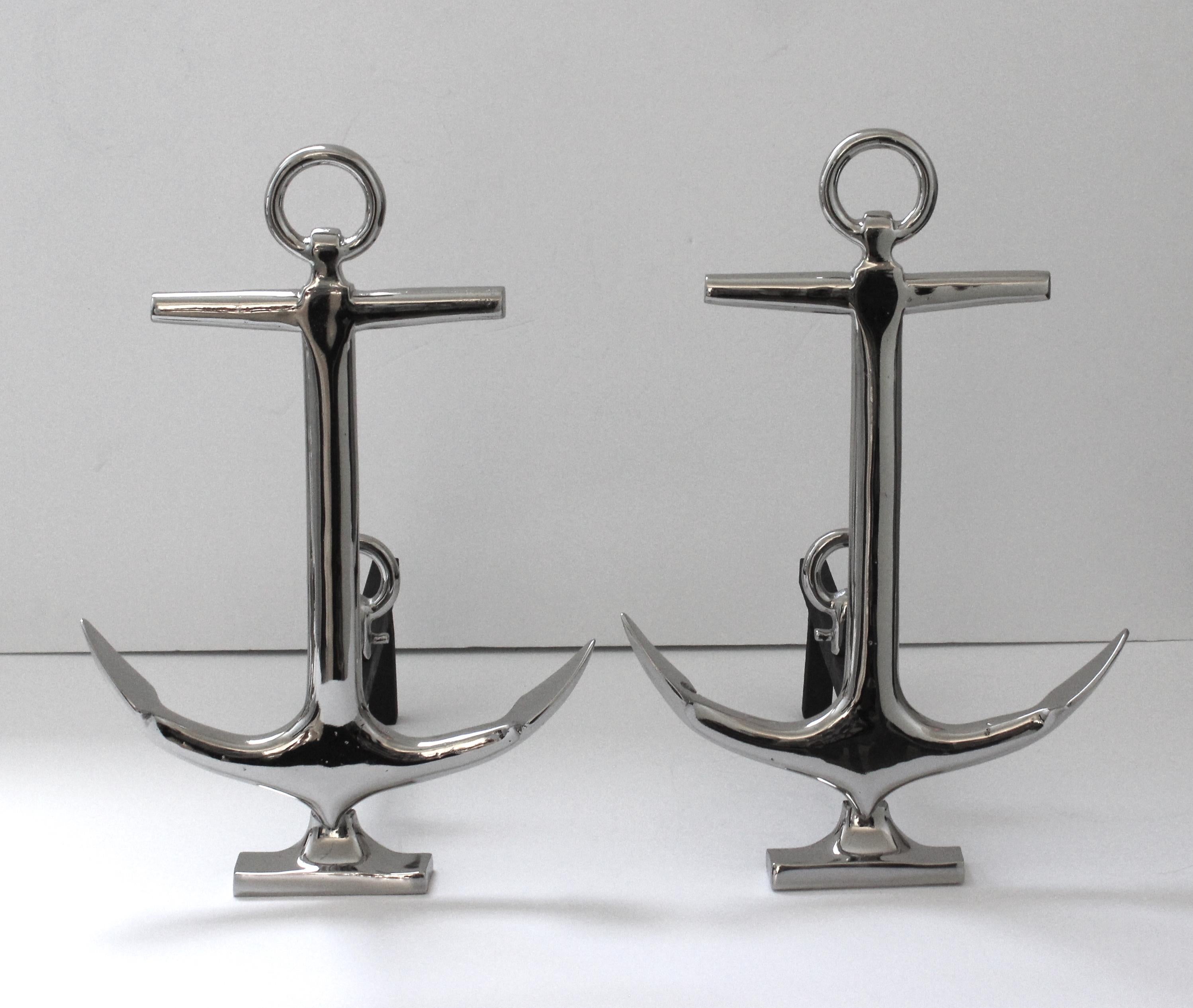 This stylish and chic set of nickel-plated anchor-form andirons date to the 1930s and are very much in the style of pieces created by Puritan. 

Note: The set have been professionally restored with a polished nickel-plated finish.