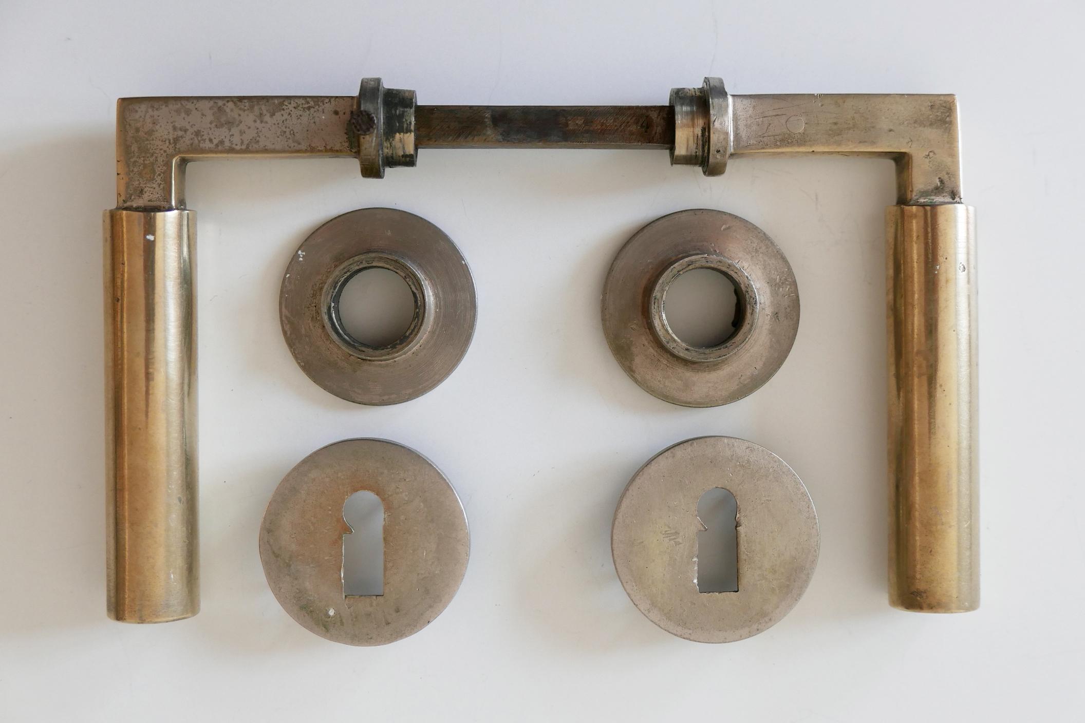 Set of nine original, minimalistic Bauhaus door handles. Designed by Walter Gropius (founder and first director of German Bauhaus School) and Adolf Meyer in 1923, Weimar, Germany. Executed in 1930s by Wehag (Die Wilhelm Engstfeld AG, Heiligenhaus,
